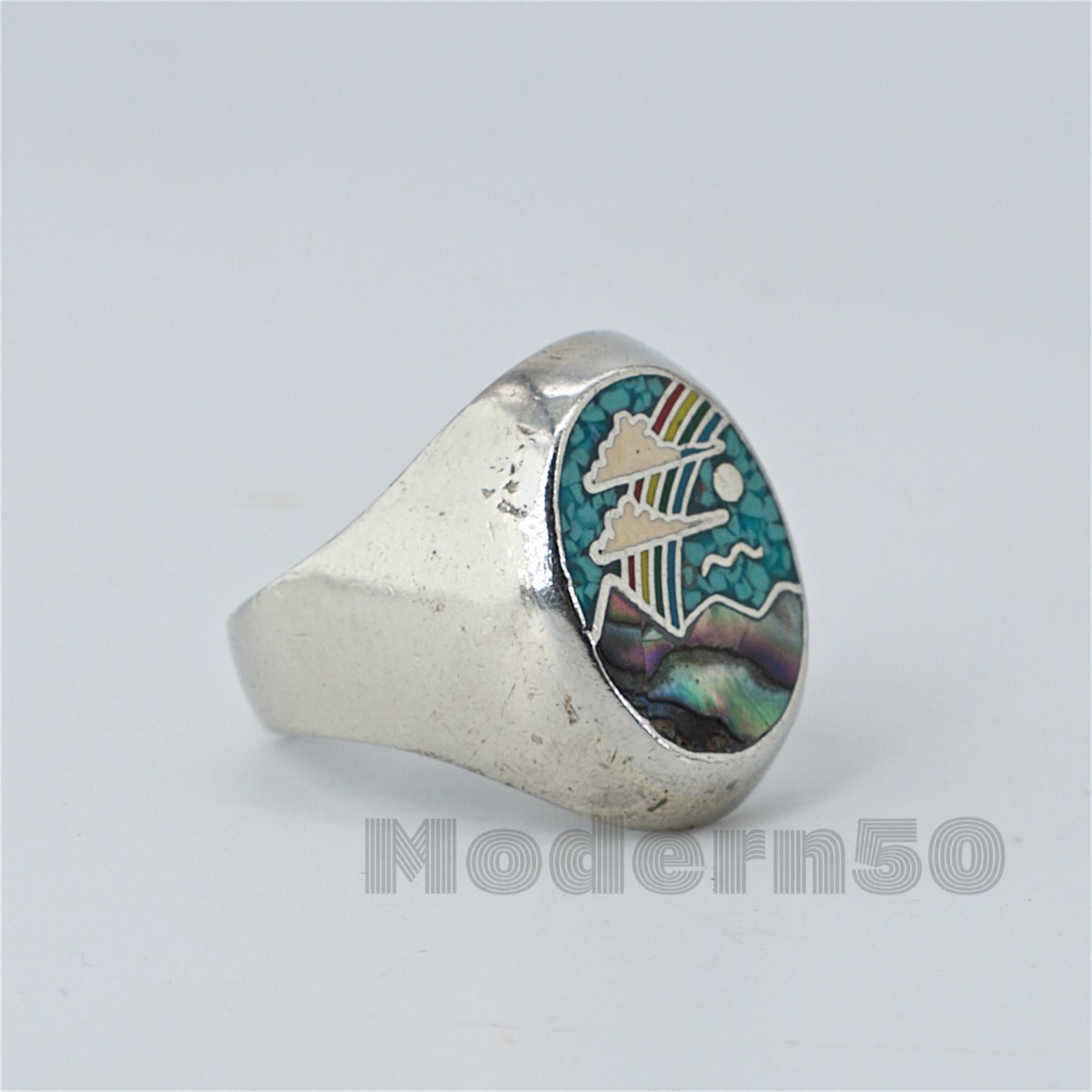Very well loved and worn, so as you can see it shows wear. Crushed turquoise, abalone, enamel on solid sterling ring, unmarked, size 10.
