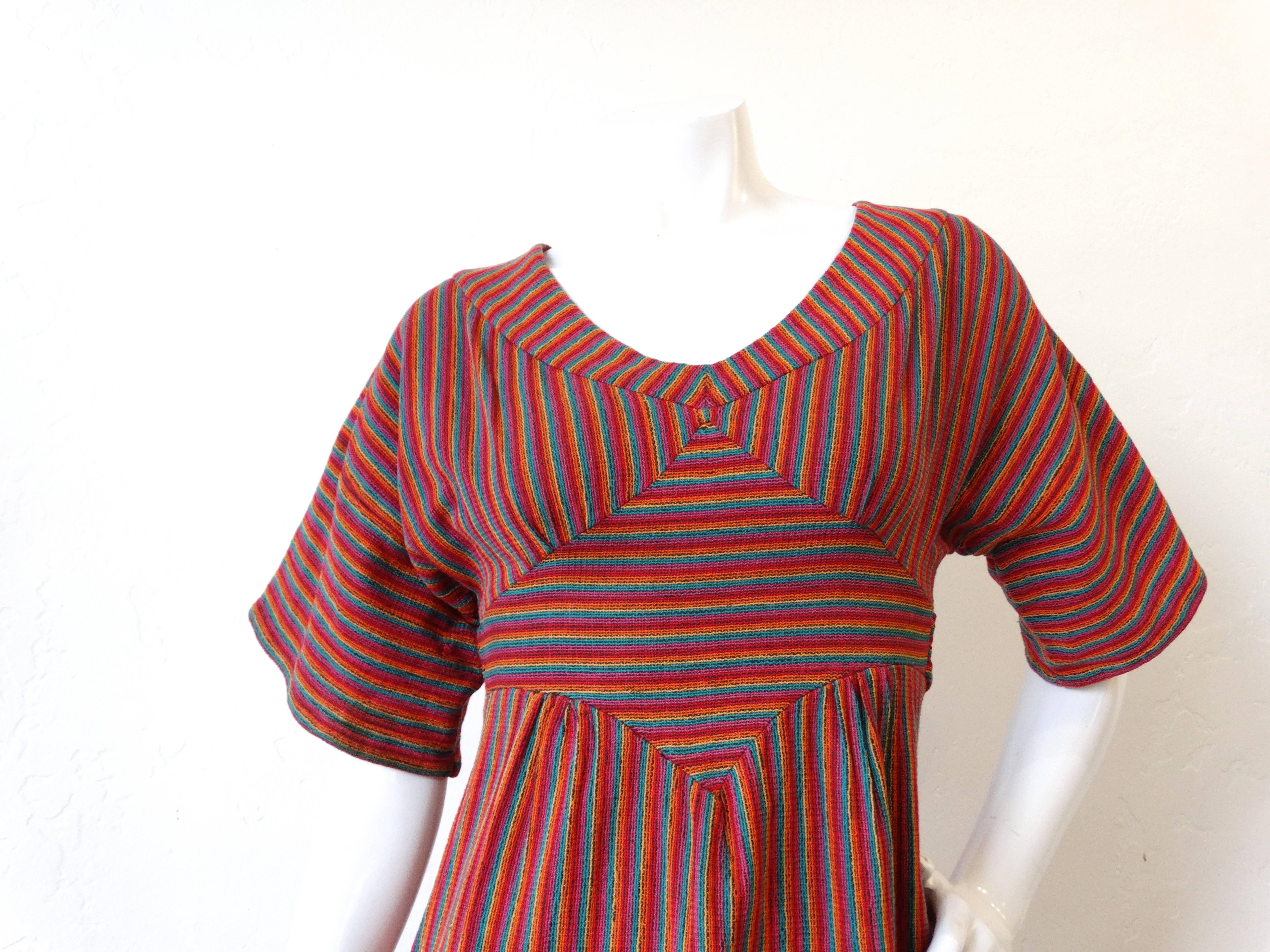 This is a fabulous dress from the 1970's  marked a size Medium, Made in Israel designed by one of my favorite middle eastern designers Rikma! Woven cotton with bright beautiful colors and patterns makes this dress a bohemians girls dream! Fits slim