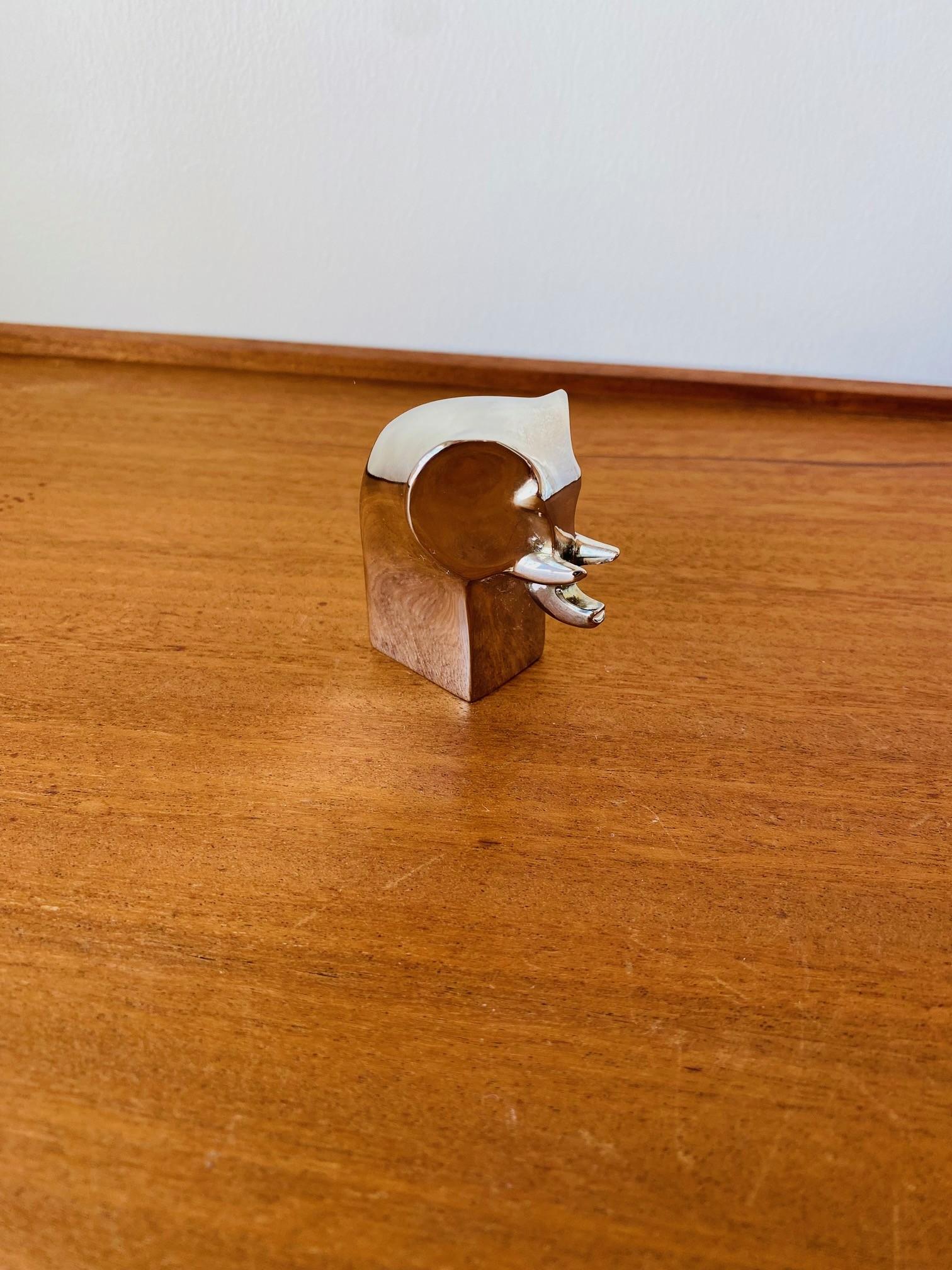 Mid-Century Modern Signed Dansk Silverplated Elephant Figure. Vintage silver plated paperweight figurine designed by Gunnar Cyren for Dansk in the 1970s. Signed Dansk Designs Japan GC on bottom. Minimalist and simply gorgeous. 
Mid-Century,