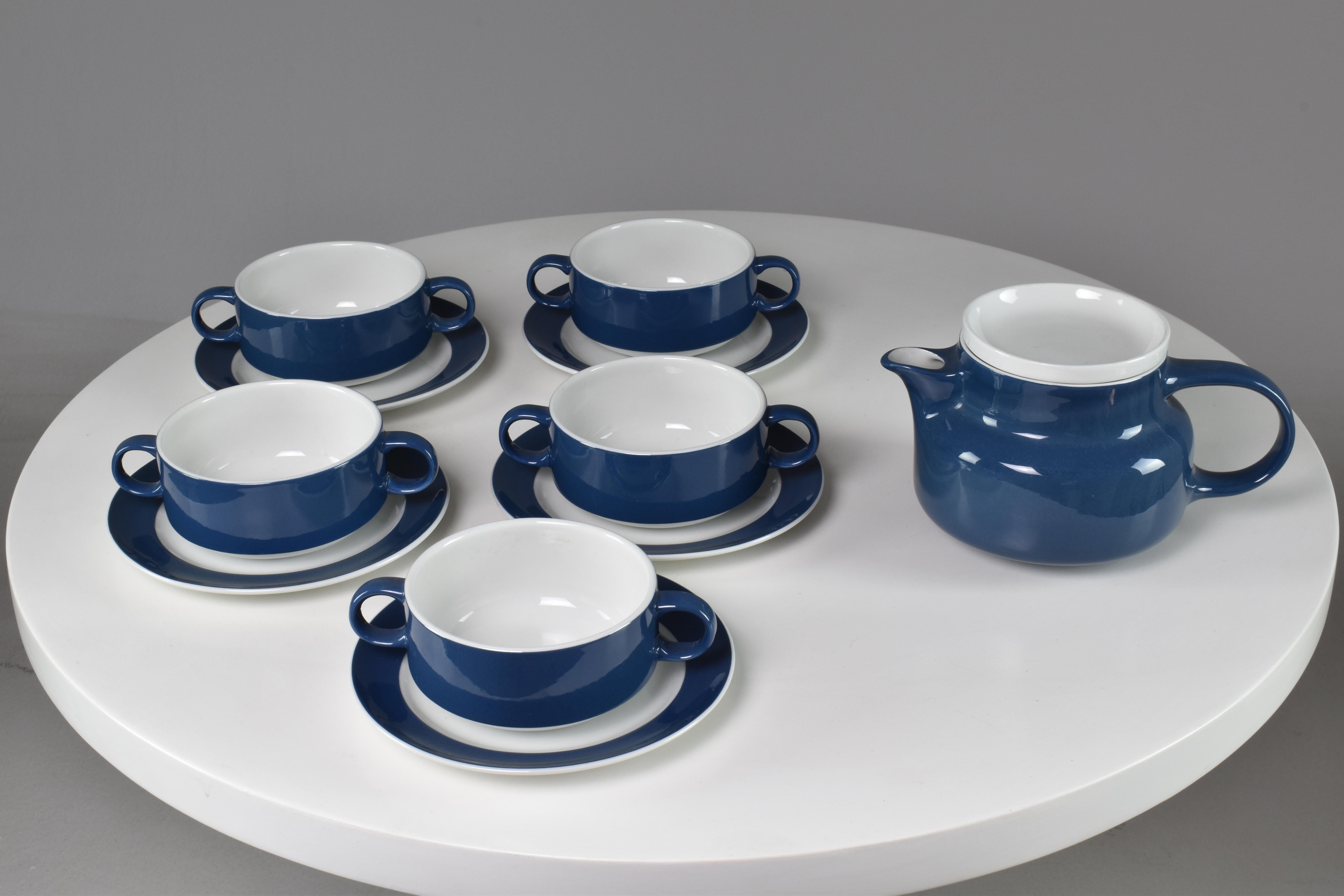 A fantastic collectable tea or coffee set of 5 Italian blue and white porcelain tea or coffee cups with saucers and a teapot signed Richard Ginori from the 1970s. They brilliantly pile up on top of each other and on top of the teapot alining