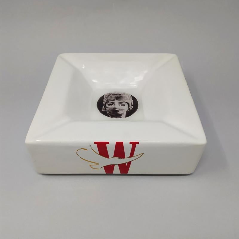 1970s Rare  Porcelain Ashtray/Vide Poche by Piero Fornasetti for Winston accessories. Signed at  the bottom.
The item is in very good condition.
Dimensions:
W 7,28 in. x D 7,28 in. x H 2,75 in
W 18,5 cm x D 18,5 cm x H 7 cm