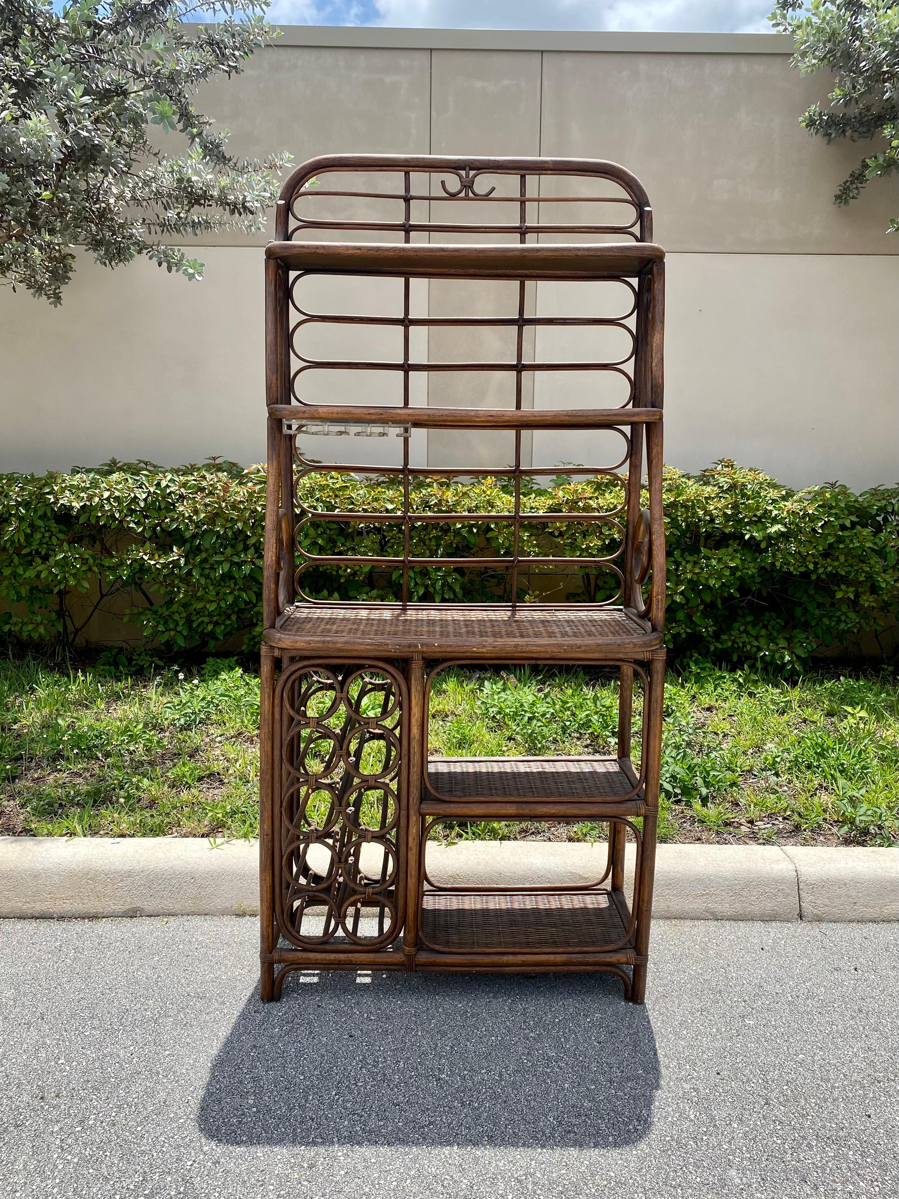 The beautiful rare rattan bar or bakers rack is statement piece which is packed with personality!  Just look at the details on this beauty! The rack was individually produced and finished with the highest level of hand craftsmanship. The display