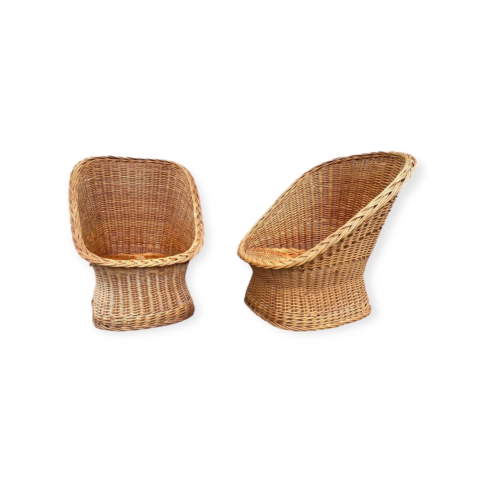 Excellent stylish pair of woven Rattan or Wicker chairs. The hourglass shape makes this pair an irresistible his and hers set with one chair slightly bigger than the other. Cushions or seat pads are not included. This allows you to choose the seat