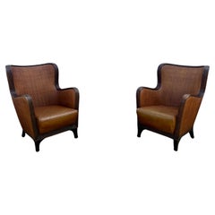 Juego de 2 sillas de ala curvadas de estilo Ralph Lauren en piel de ratán de los años 70