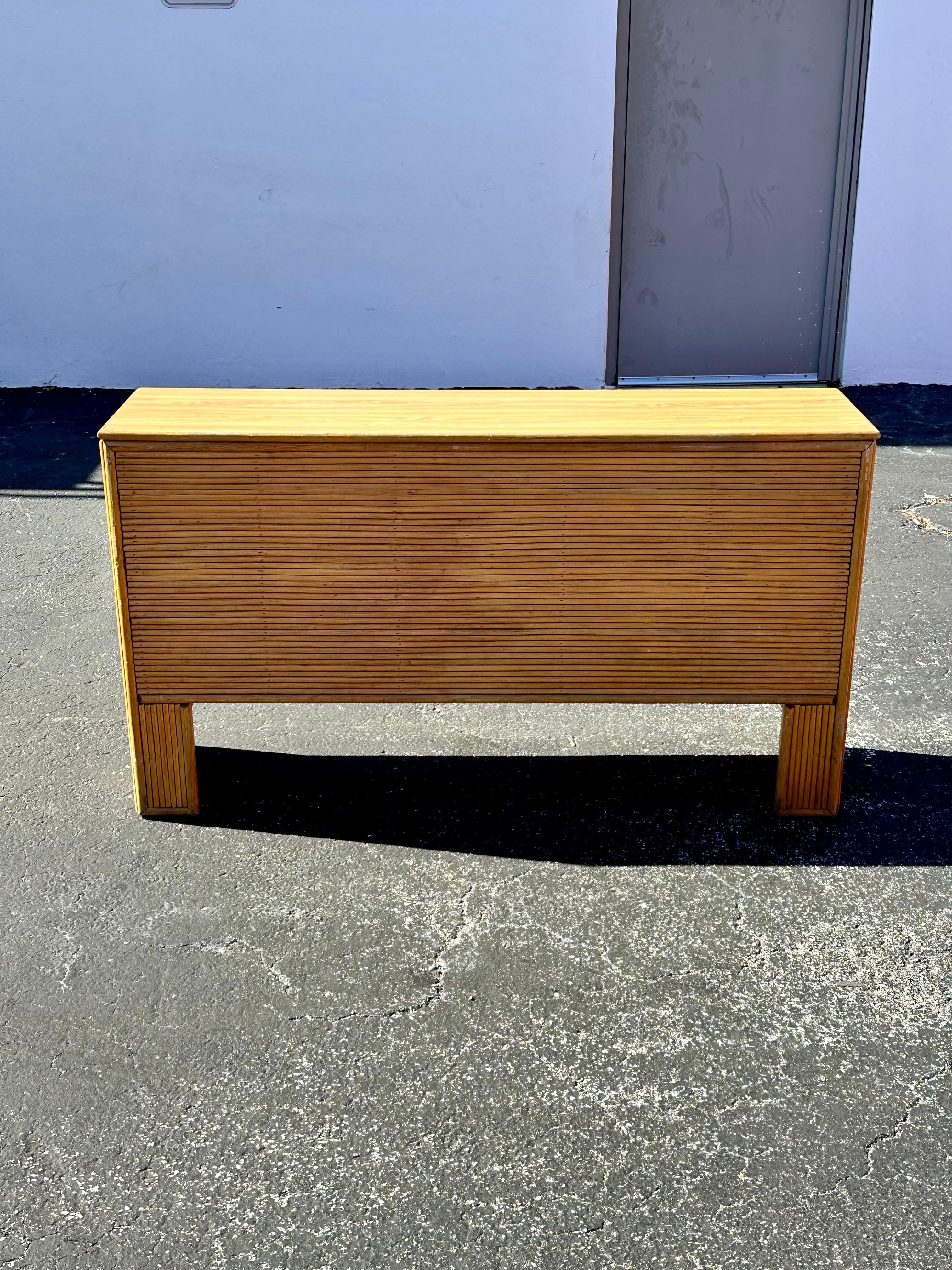 On offer on this occasion is one of the most stunning and rare, rattan and storage trunk table you could hope to find. In original and unfinished condition. Outstanding design is exhibited throughout. The beautiful table is statement piece and