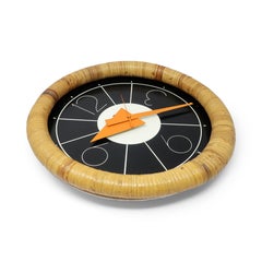 Orologio da parete in rattan anni '70 di Arthur Umanoff per Howard Miller