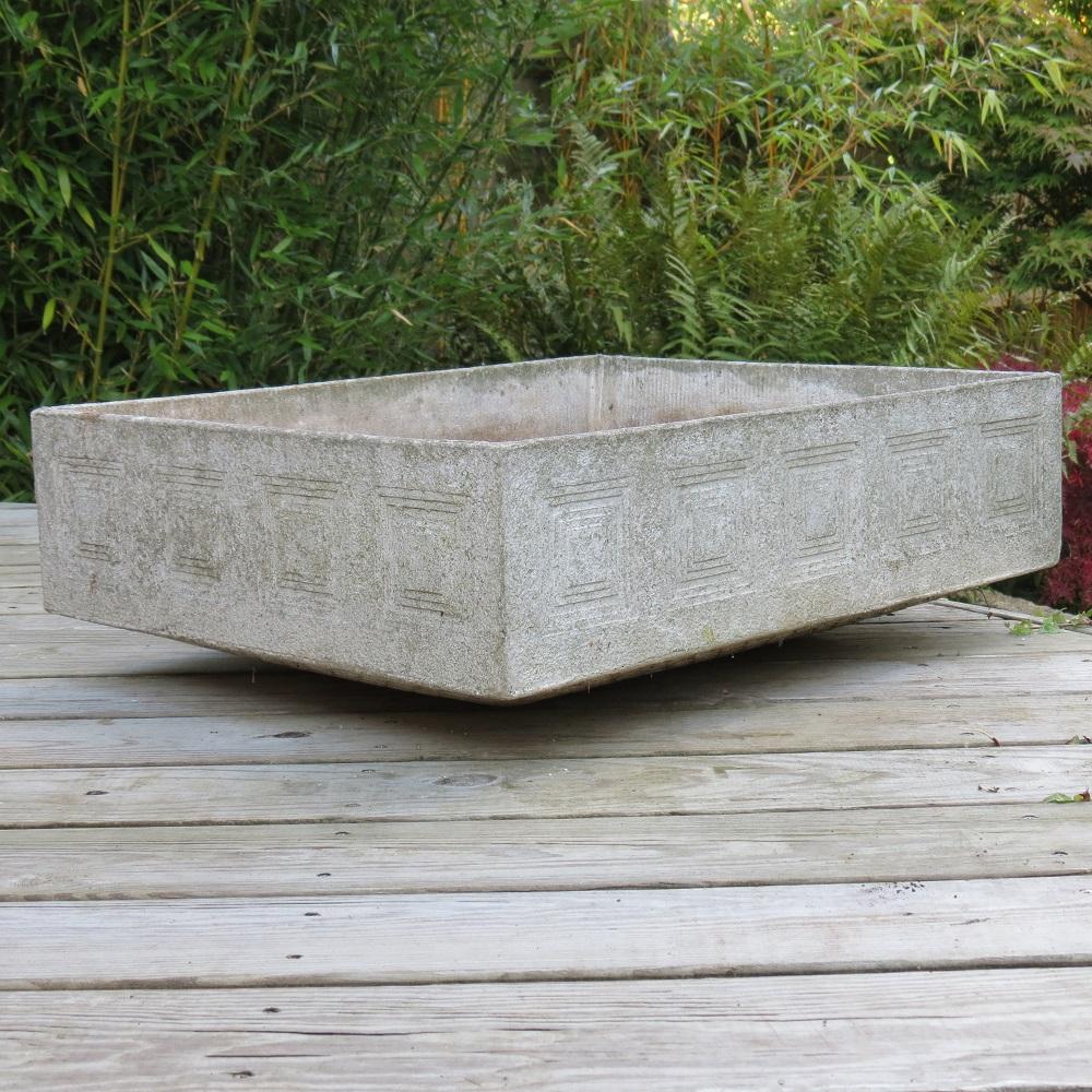 Very stylish, elegant garden planter made from concrete. Wonderful recessed concentric square decoration to each outer face, allowing the decoration on the planter to be viewed from each side. A tapered base gives the impression the planter is