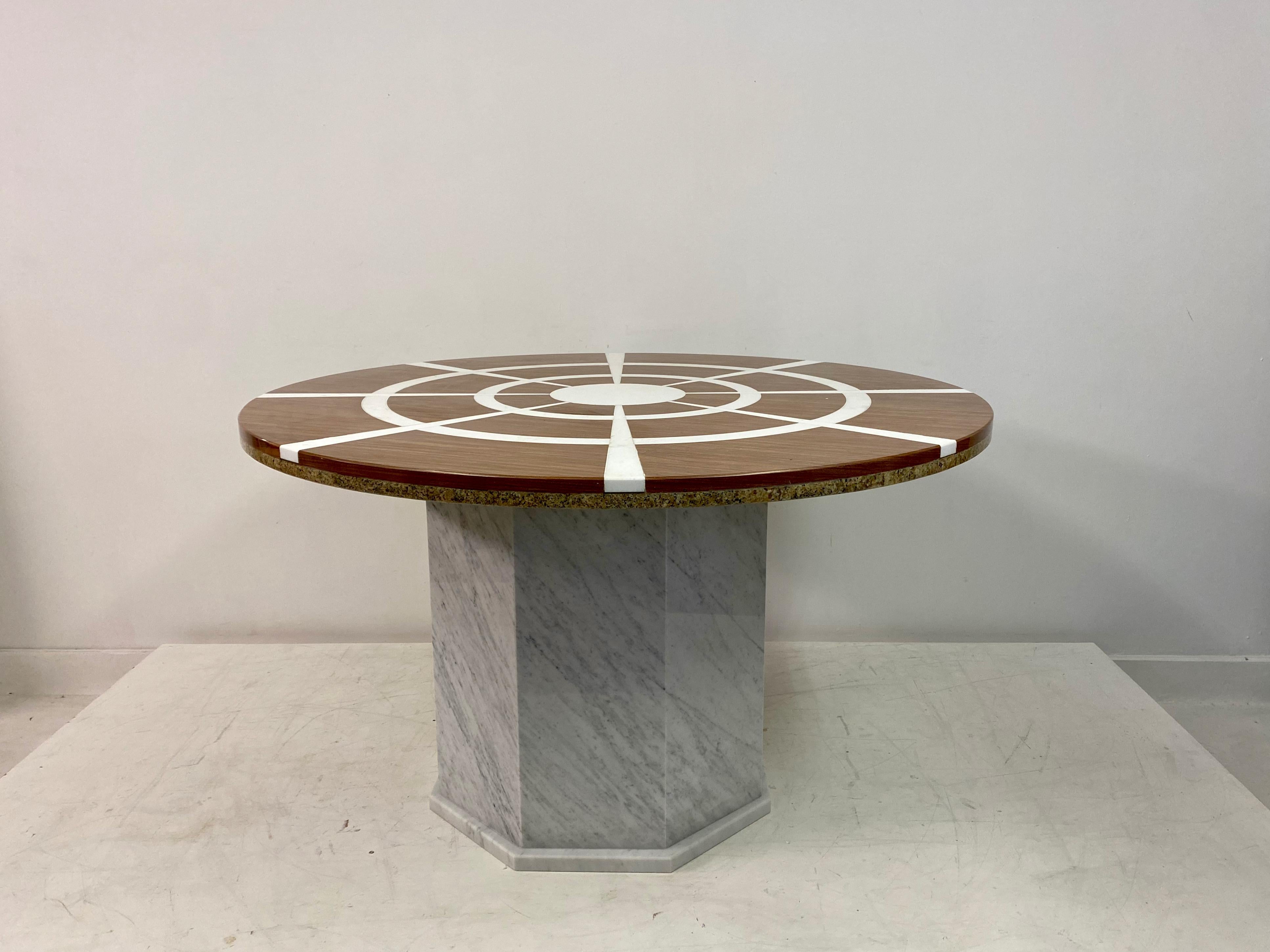 Marble dining table.

Red marble top with white stone inlay.

Double skin marble top.

Carrara marble base.

1970s/1980s Italy.