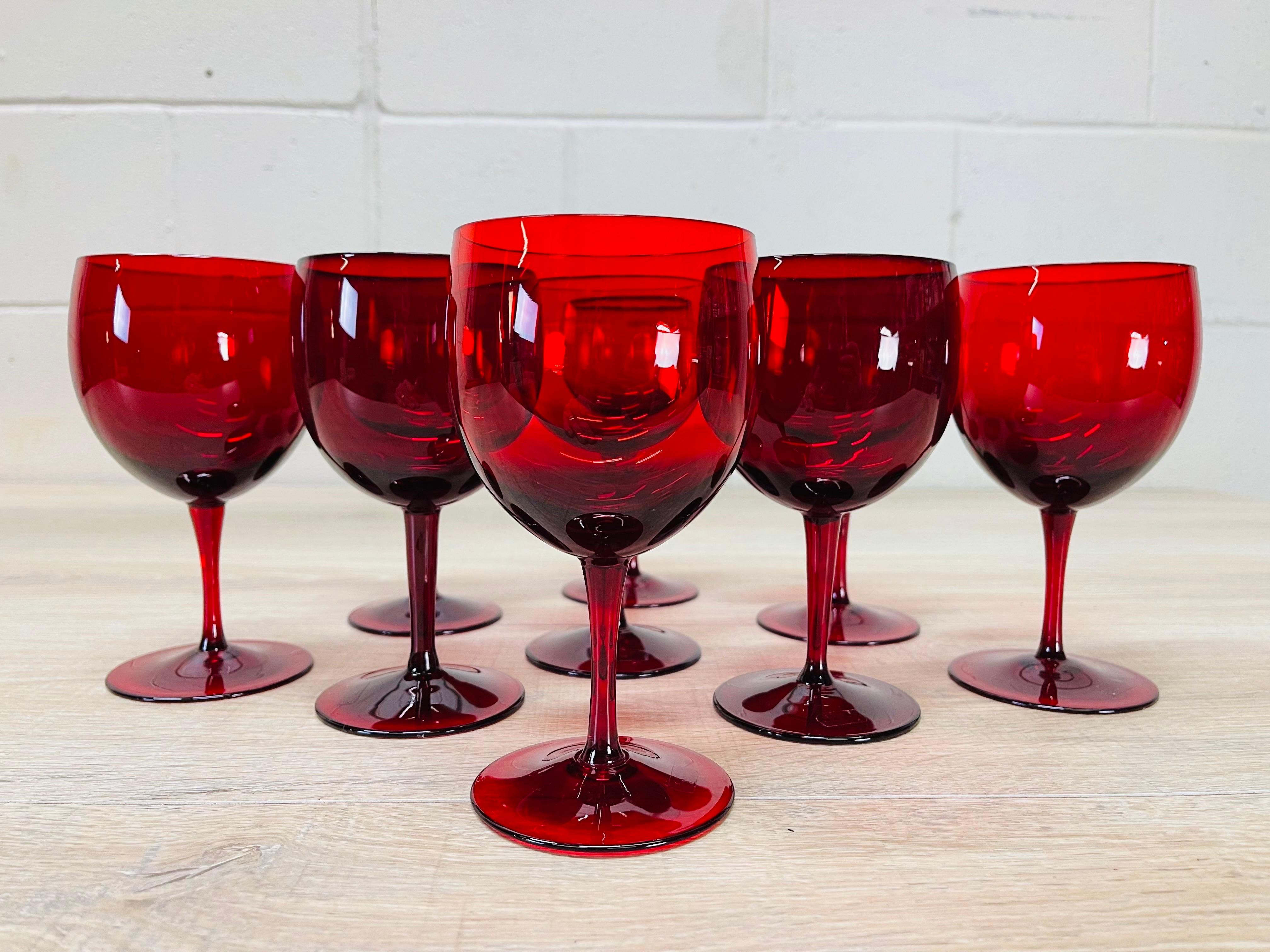 Vintage 1970s set of nine red glass Bohemian wine stems. Excellent used condition. Faintly marked Czech glass.