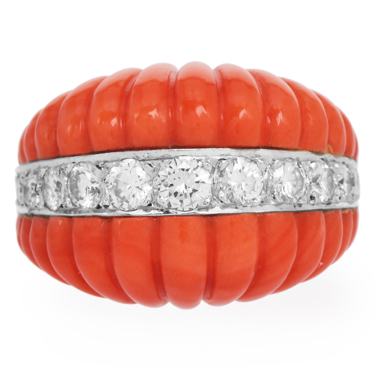 This chic 1970s Vintage cocktail ring is crafted in solid 18K yellow gold, weighing 13.6 grams and measuring 15mm wide x 10mm high. This trending captivating ring exposes at the center an enchanting oval cabochon of genuine natural red Coral approx.
