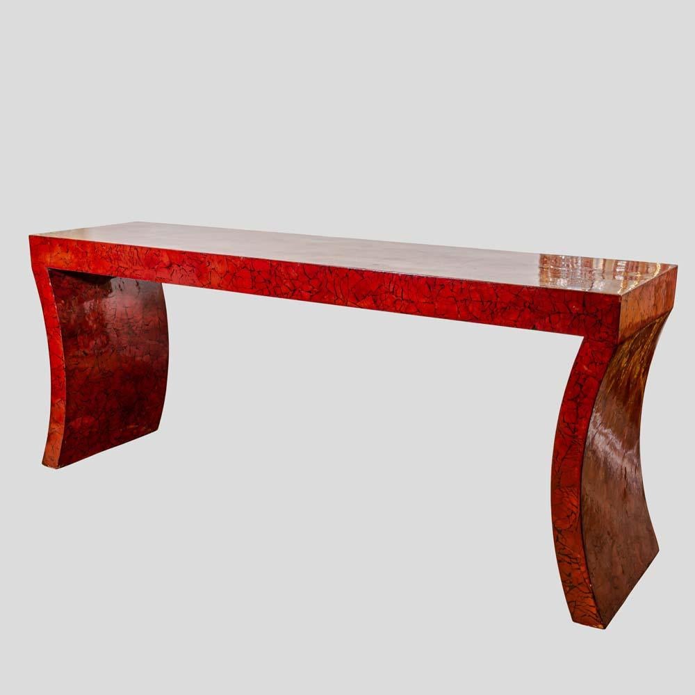 An impressive red laquer crackleware finished Console Table 1970s by Enrique Garcel

This remarkable console table, boasting an impressive red lacquer crackleware finish, originates from the 1970s. Its strikingly curved shape and beautifully aged