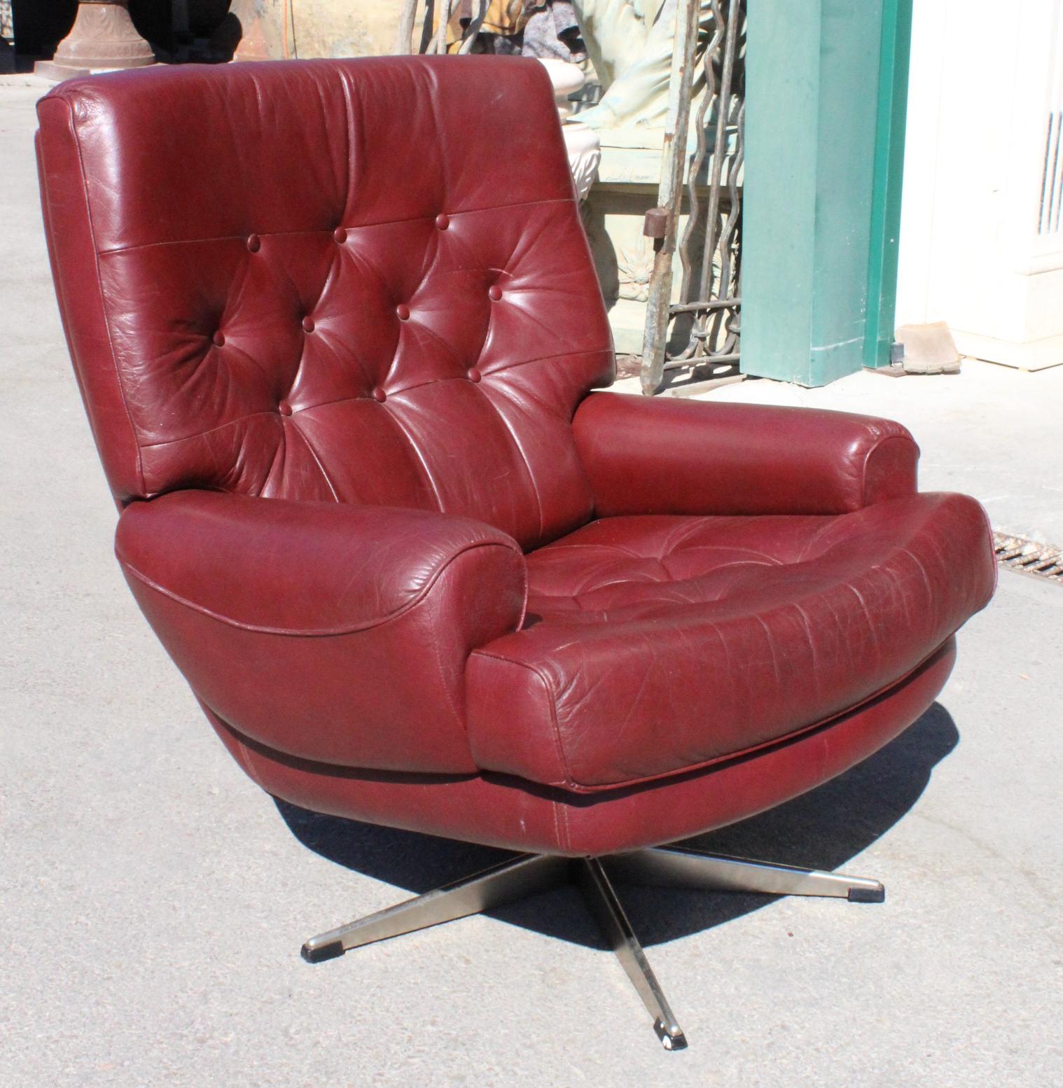 1970s red leatherette office sofa with steel legs.