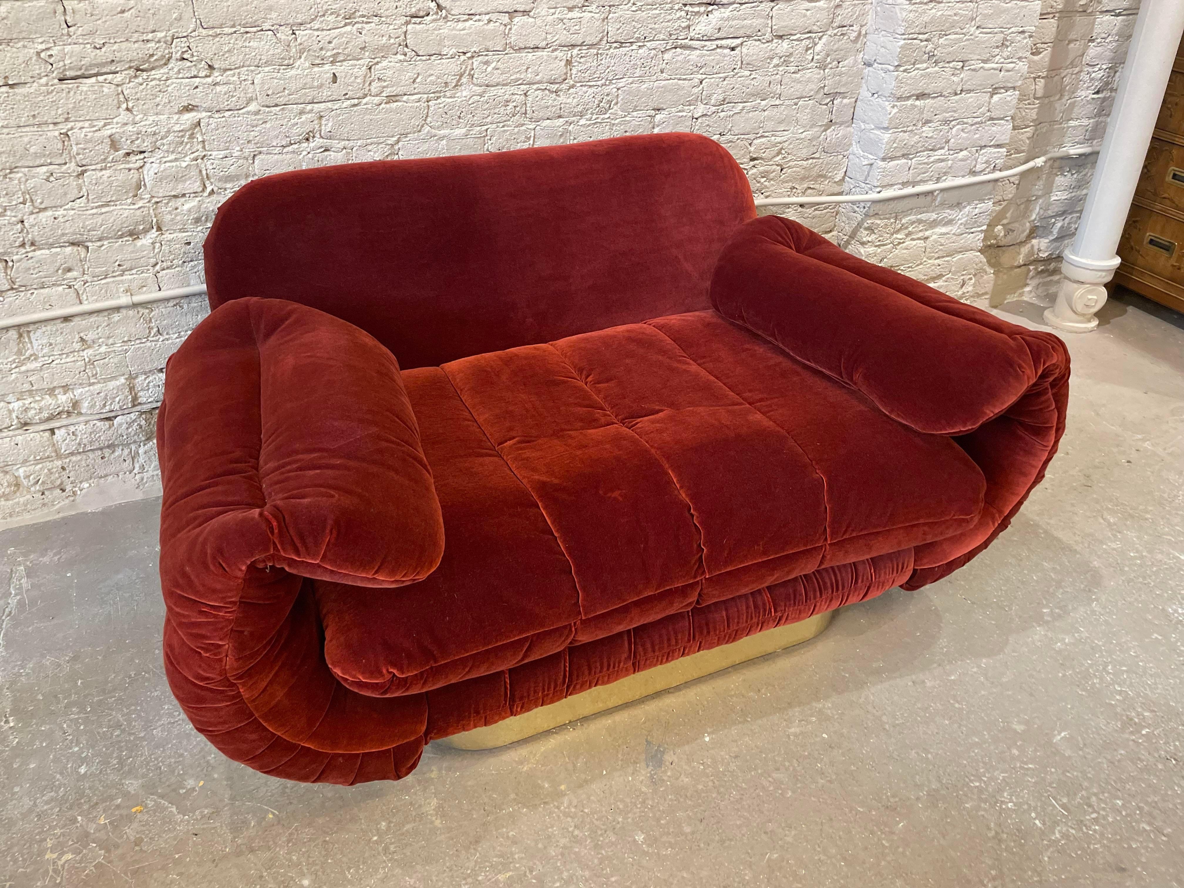 Late 20th Century 1970s Red Loveseat with Curved Arms & Brass Plinth Base For Sale