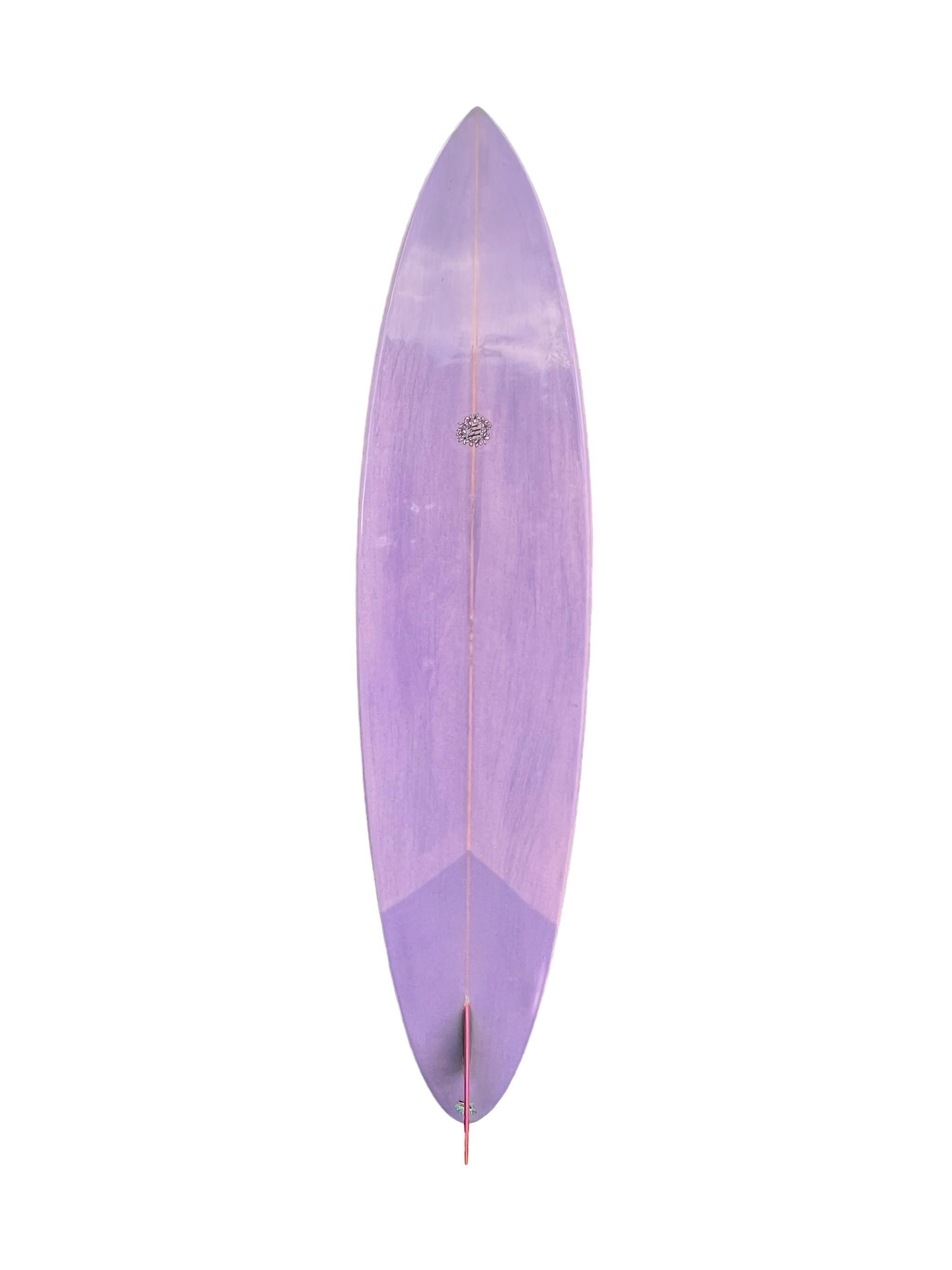 1970s Replica Owl Chapman Underground Hawaii pintail surfboard made in the early 2000s. Features beautiful amaranth and purple stain with complimentary glass-on single fin. Dual pinstripes with vintage 1970s Owl Chapman Underground Hawaii laminate.
