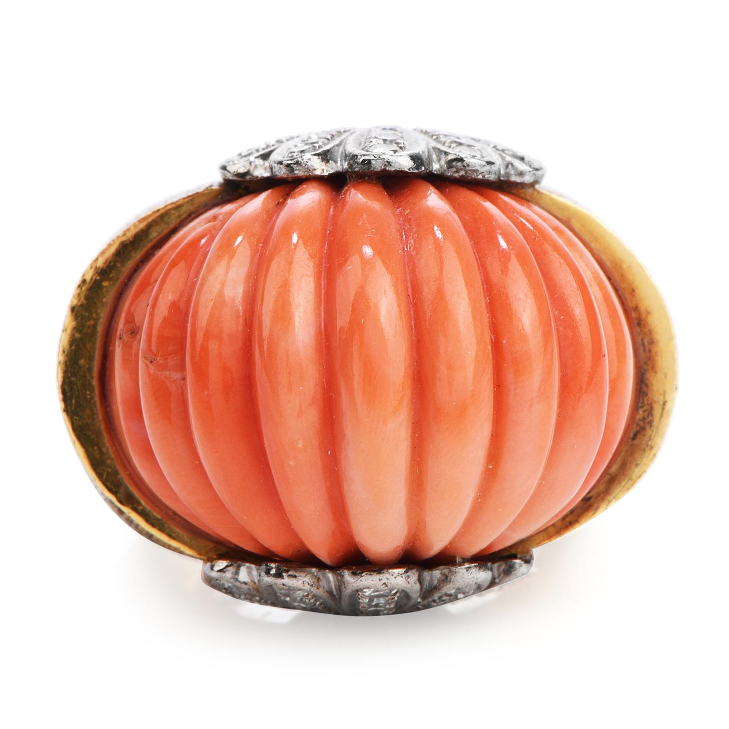 From the late 1970s, this Vintage Retro solid 18K Yellow Gold ring, is flanked by (2) diamond-encrusted shells in 18K White Gold.

Exposing a Genuine Carved Natural Salmon Color Coral in the center, this stylish beauty measures  22.12 x 14.5 mm, 13