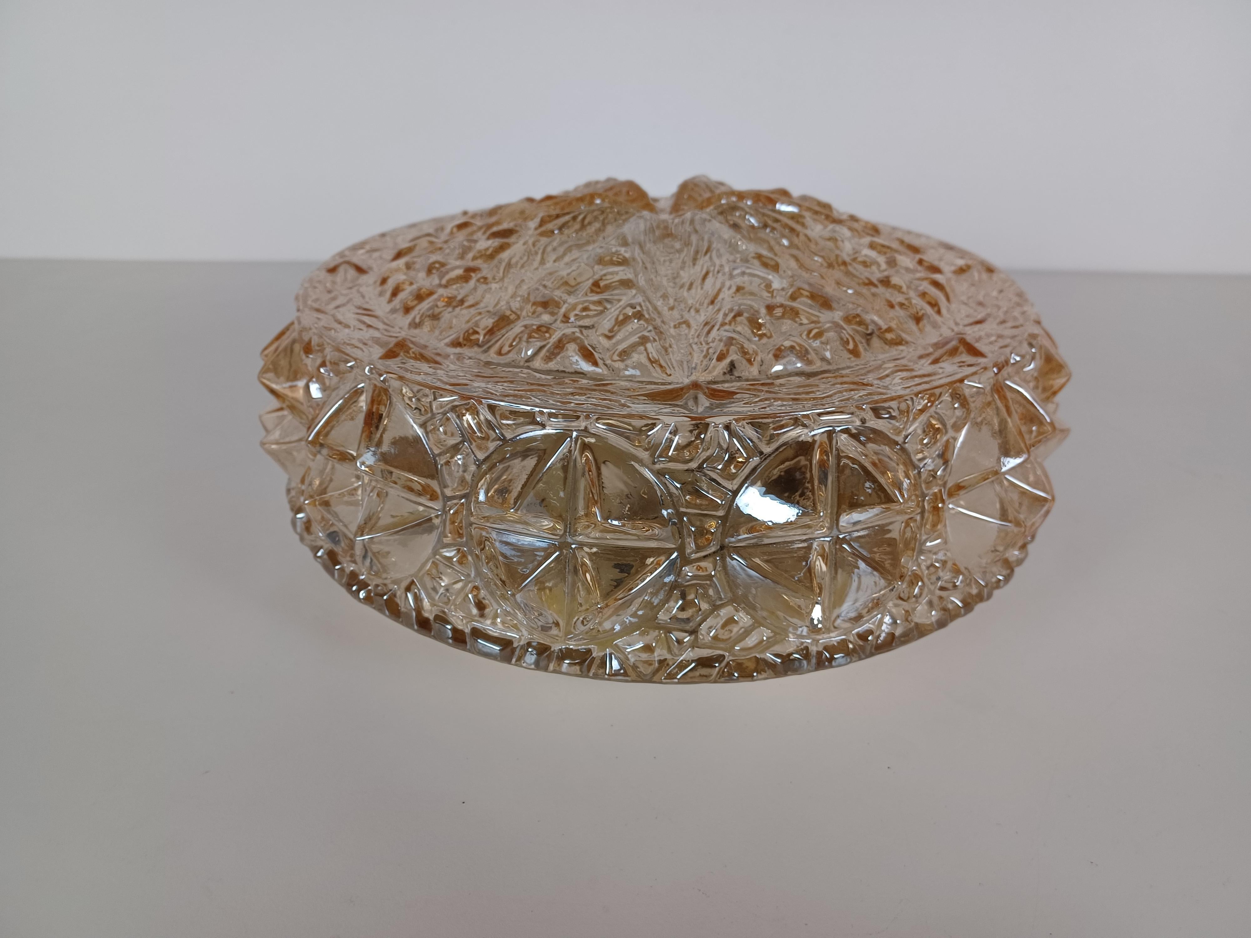 1970's Rewired Danish flush mount in glass 

The flush mount feature a completely rewired 1 light fixture  with a large thick glass lampshade with a structured surface.

The flush mount has been cleaned and rewired to ensure that it's in very good