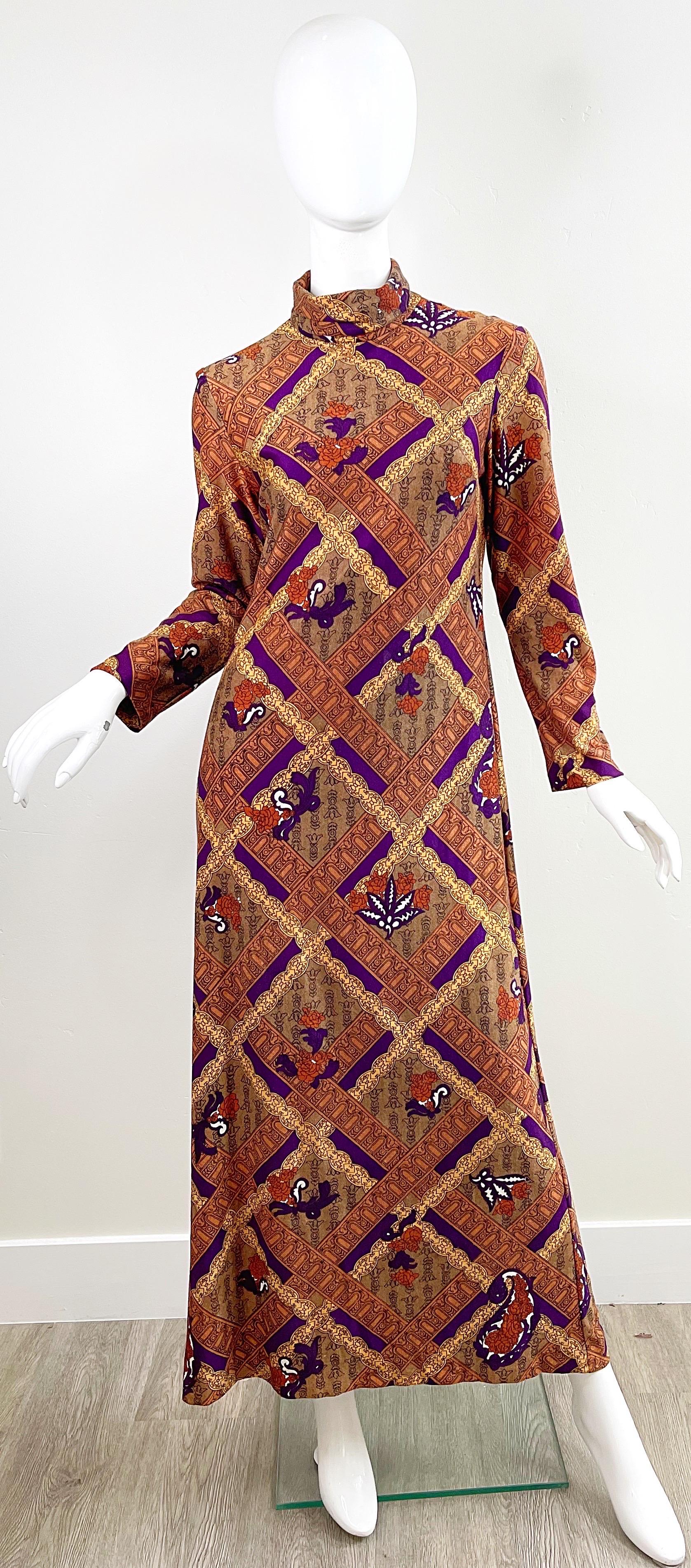 Amazing early 1970s RHONA ROY of England abstract print maxi dress ! Warm colors of purple, tan and brown throughout.
In great condition 
Approximately Size Medium 
Measurements:
38-40 inch bust
32-34 inch waist 
40-42 inch hips
55 inches from top