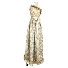 Maxi abito monospalla Richilene anni '70 in broccato d'oro