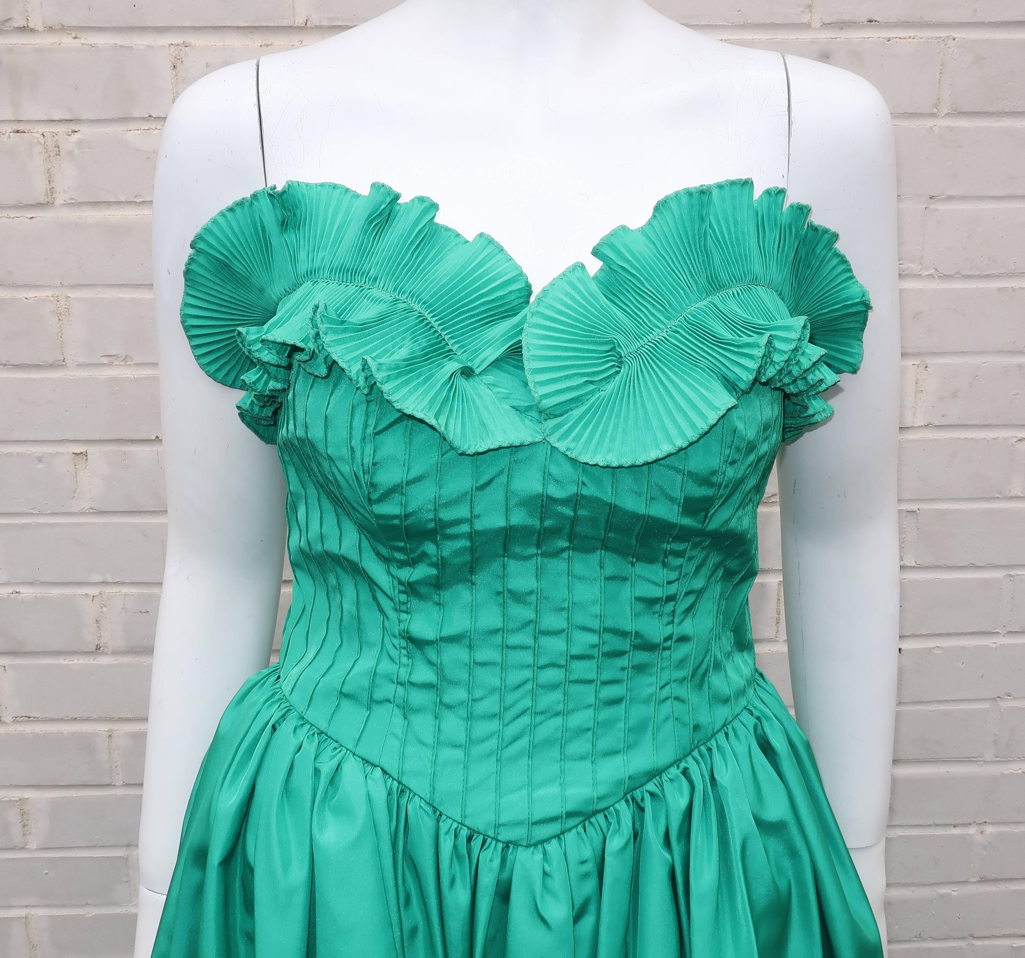 This 1970’s Richilene New York evening gown conjures up images of everything from Cinderella to old school cotillions.  The strapless silhouette zips and hooks at the back with a pintucked bodice accented with a drop v-front and back as well as a