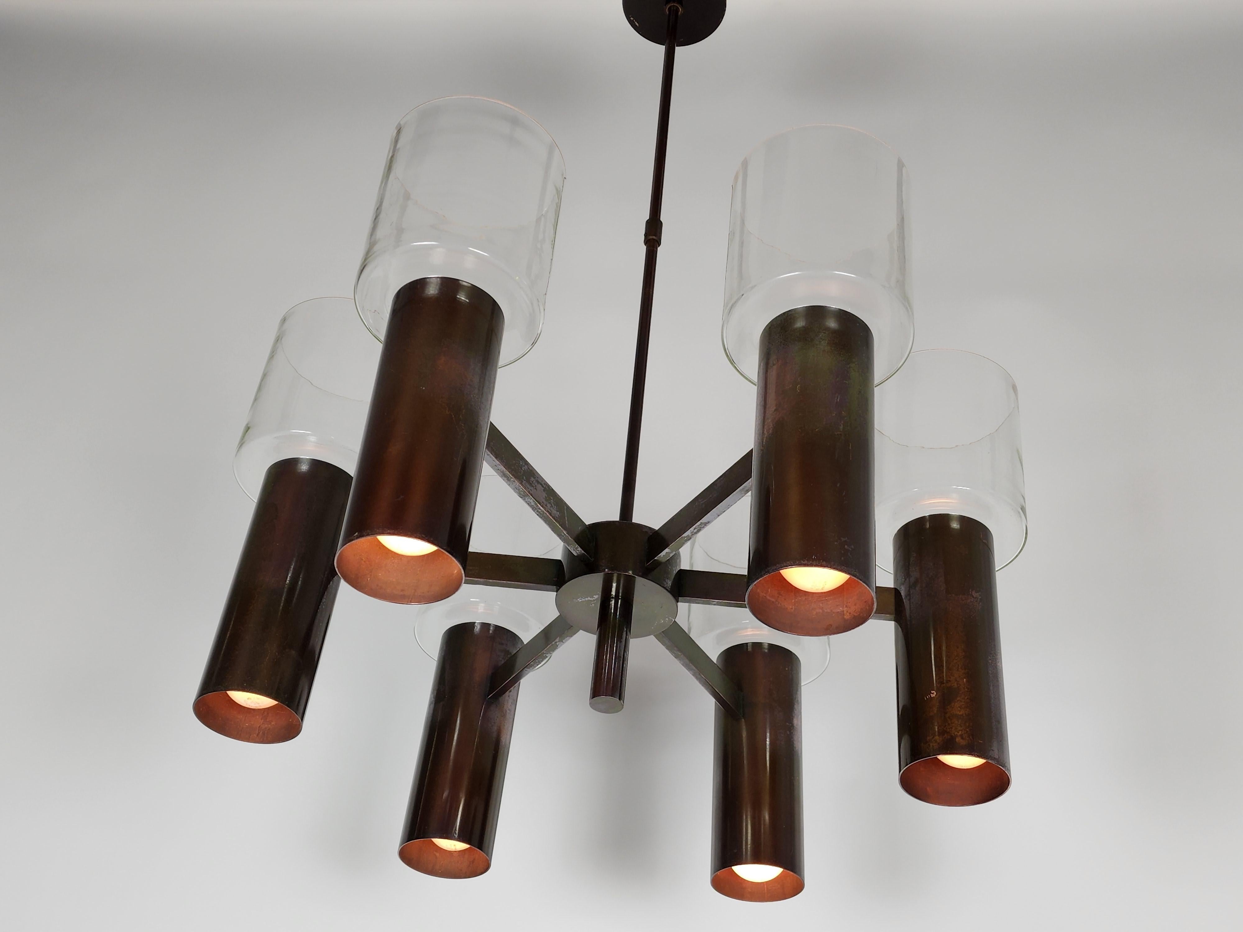 Stuart Barnes for Robert long chandelier. 

Anodized metal structure, topped by six huge mouthblowed clear glass hurricane shade.

Regular E26 North American medium size socket rated at 60 watts each.

Six upward and six downward light