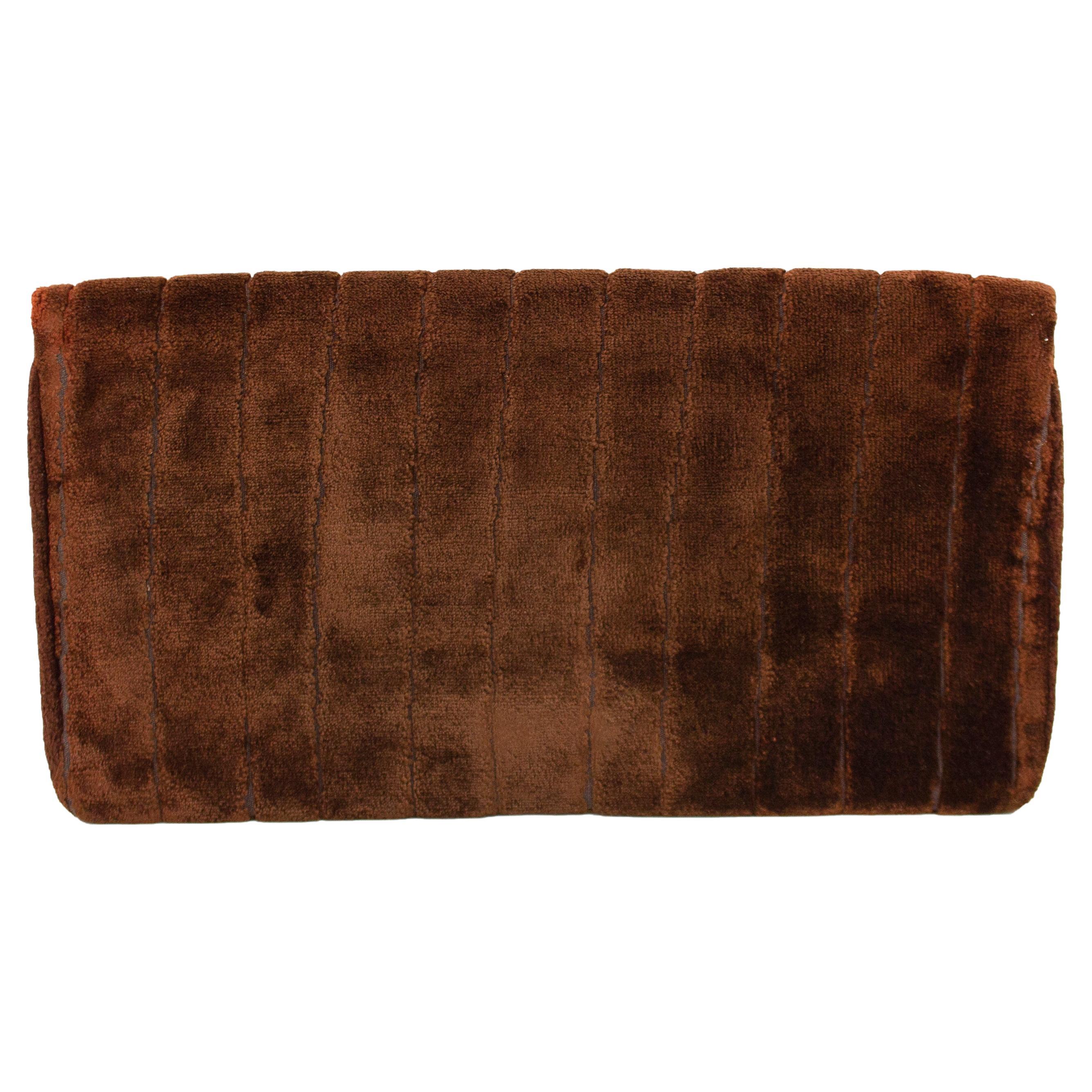 Roberta Di Camerino clutch dating from the 1970s. Chocolate brown patterned velvet with with small gold 'R' logo at top left corner. Snap button closure. Brown leather interior. Good  vintage condition - some interior wear. Made in Italy. 11