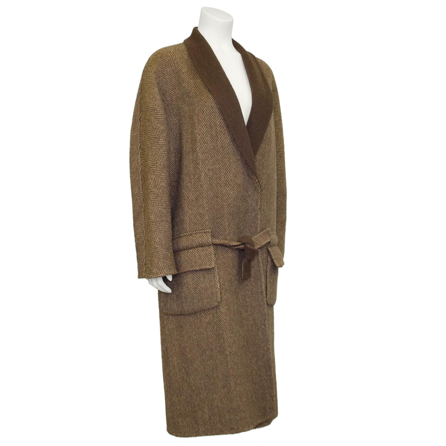 Chic and understated brown and cream wool herringbone Roberta di Camerino bathrobe inspired coat. Made to fit slightly oversized with a drop waist tie belt. Large horizontal belt loops sit above the flap pockets creating an interesting design