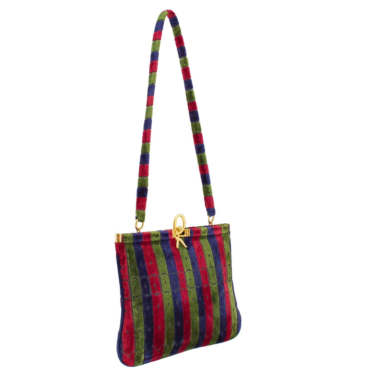 Gorgeous Roberta Di Camerino bag from the 1970s. Vertical stripes in the iconic Roberta Di Camerino jewel tone colours of red, green, and navy blue. Stripes also feature a trompe-l'œil illusion of watch bands. Gold tone hardware with a large R