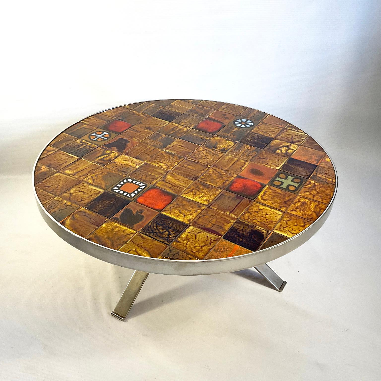 Large Roche Bobois round coffee table from the 1970s, nickel-plated metal structure and artisanal ceramic tiles on top.
