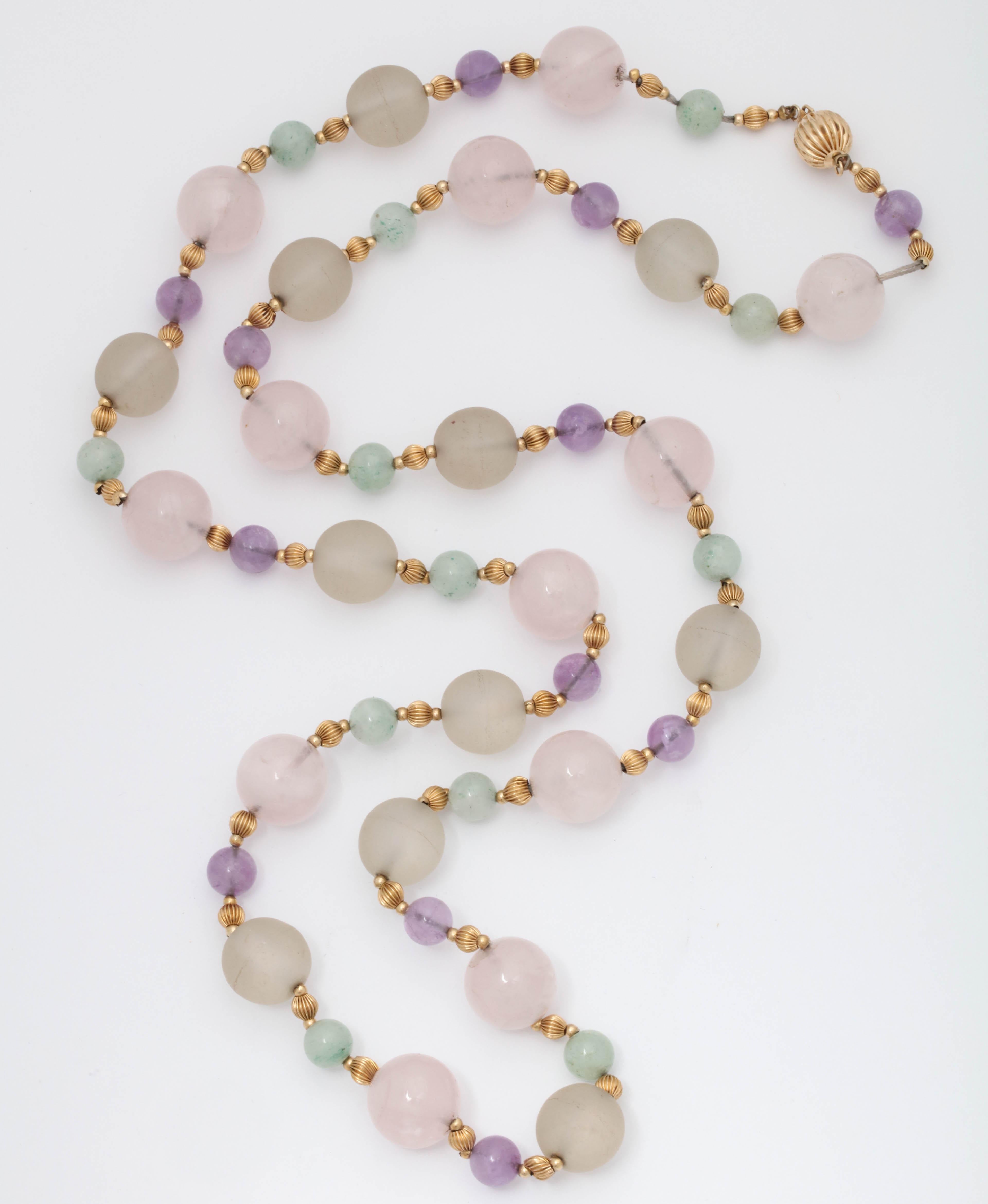 One Ladies 14kt Yellow Gold Necklace Created With Numerous Rock Crystal Beads Measuring Approximately 10MM Each. Further Designed With Alternating Amethyst Beads Measuring 6MM Each,Also Created With Numerous Jade Beads Measuring Approximately 6MM