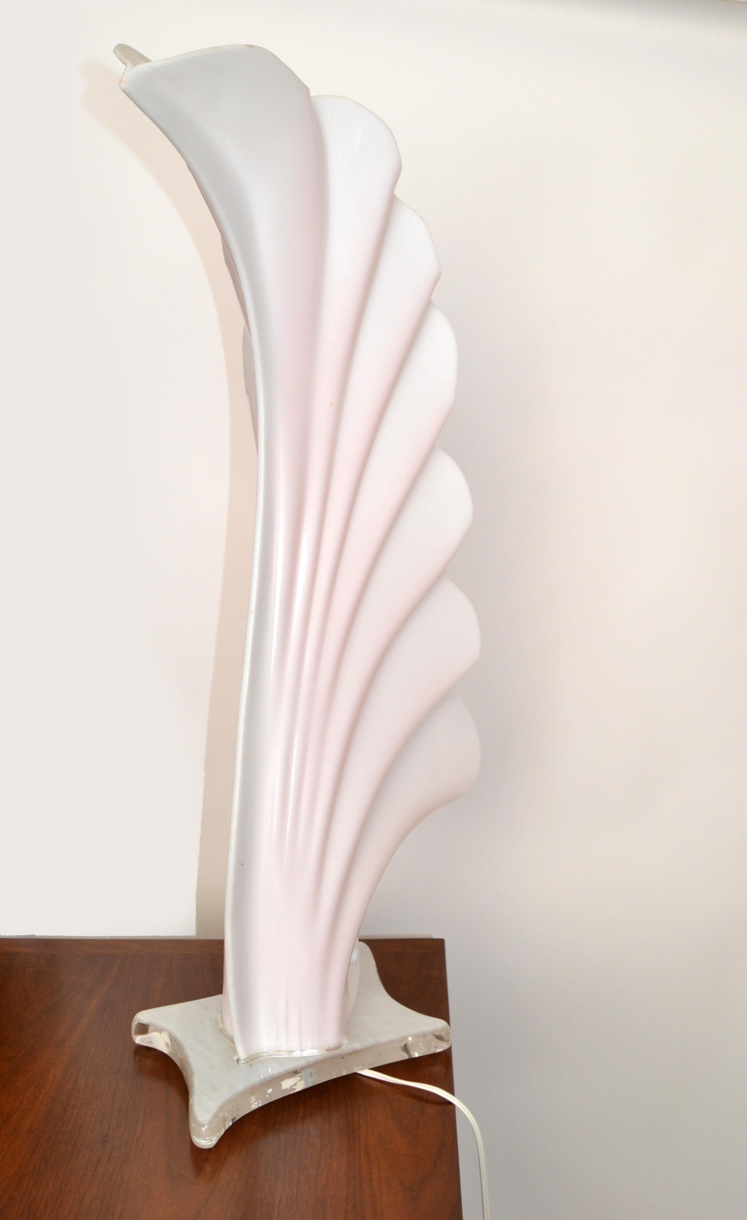 Monumental Pink and White Acrylic Table Lamp by Roger Rougier made in Canada.
US Wiring with Porcelain Socket and takes a regular or LED bulb max. 60 watts.
Base measures: 10 x 7 inches.
In good vintage condition with only light signs of wear to the