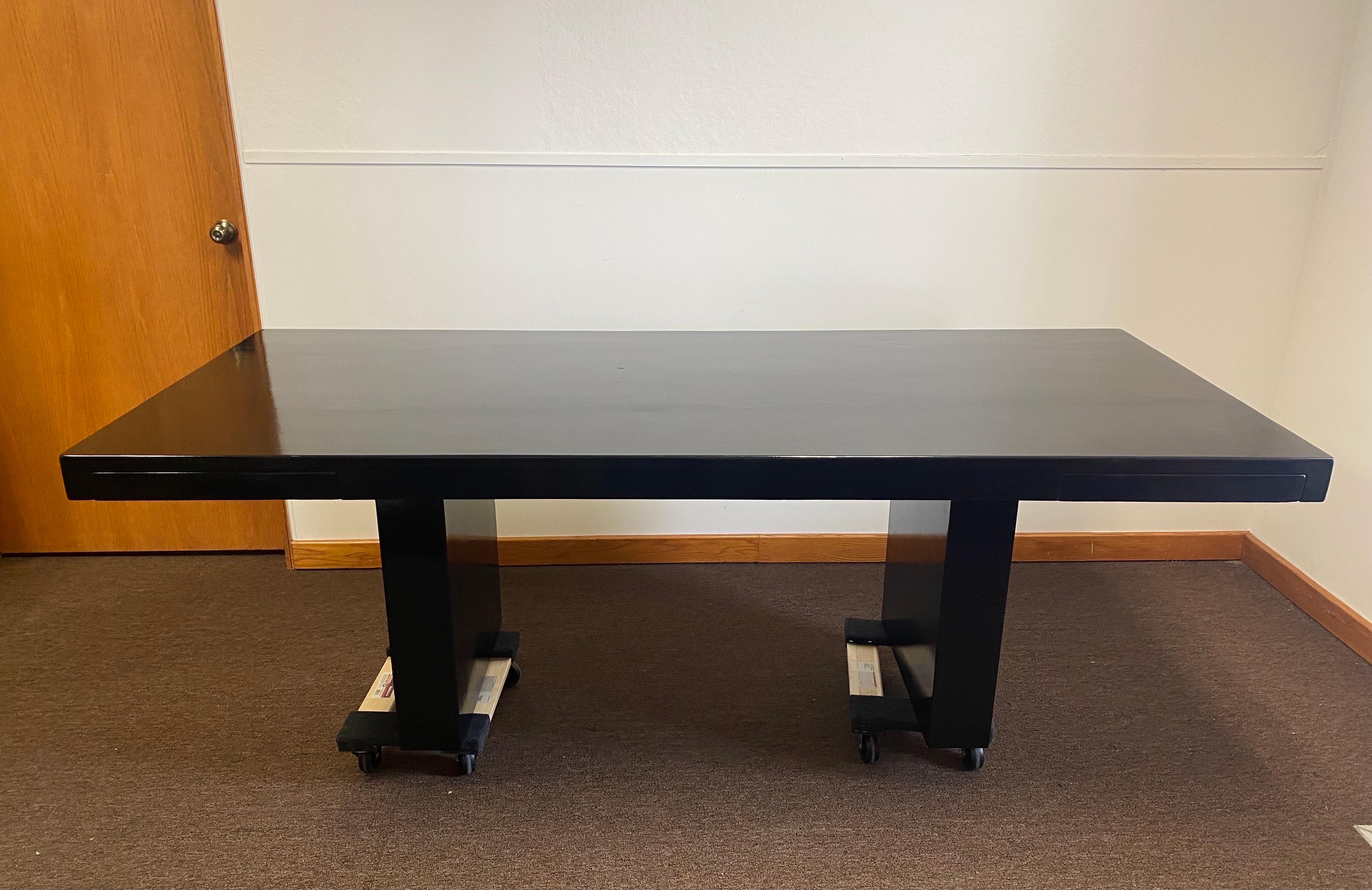 We are very pleased to offer a stunning yet sleek, desk by Roger Sprunger for Dunbar, circa the 1970s. Striking in its simplicity, this seven-feet long desk is where streamlined design meets modern elegance. The thick frame showcases a black paint