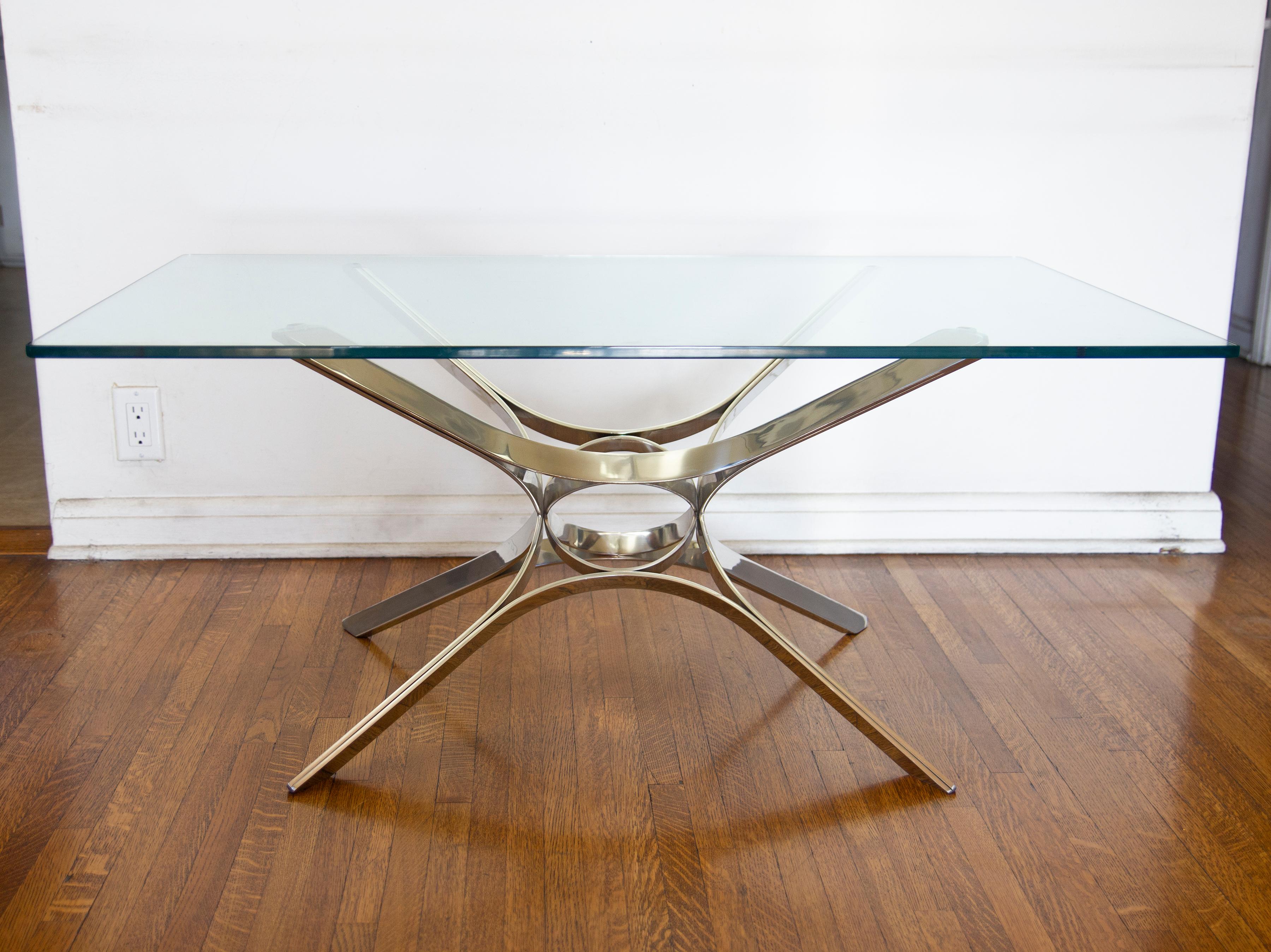 Sculptural chrome and glass coffee table attributed to Roger Sprunger for Dunbar. Excellent center piece in your living space.