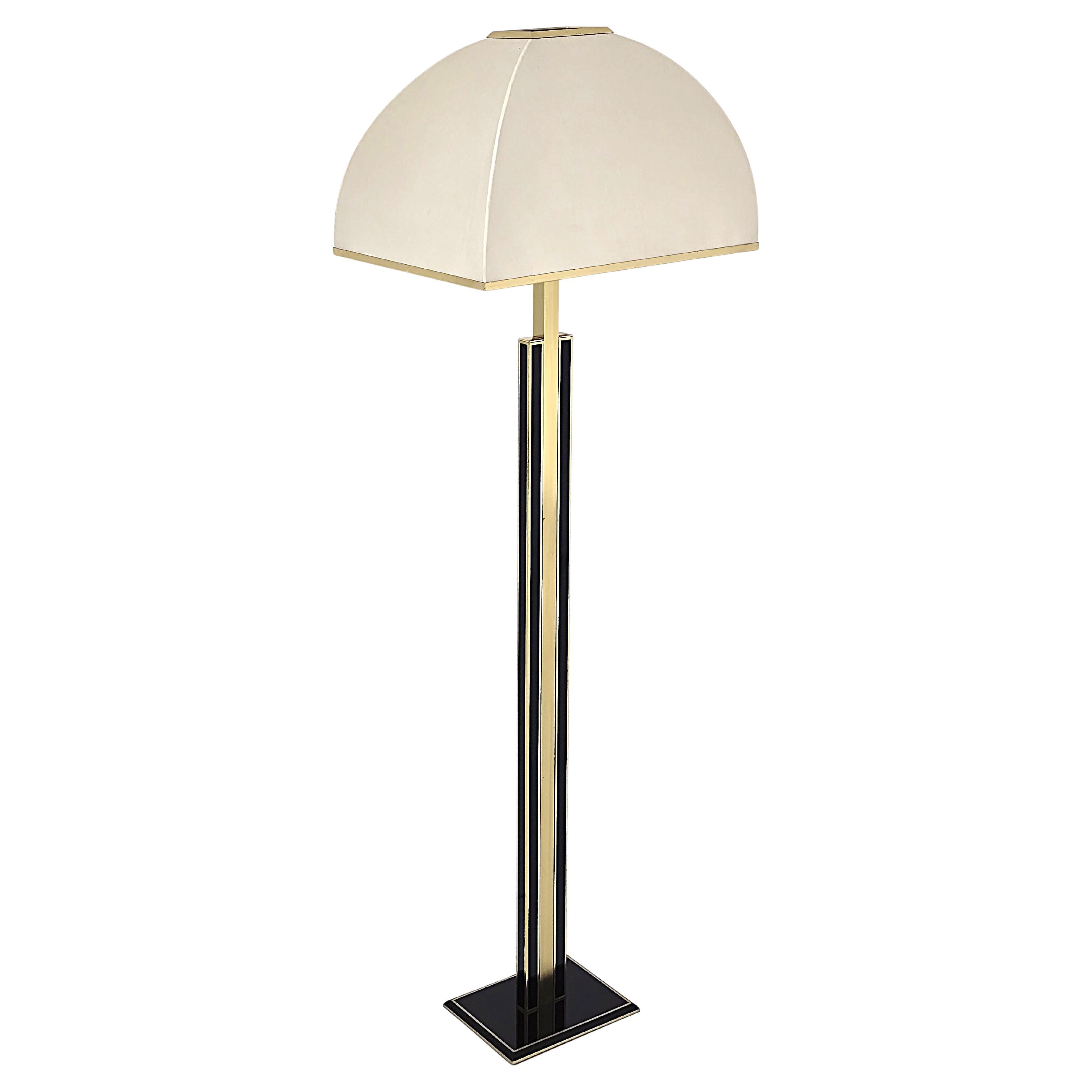 Classic Romeo Rega Massive floor lamp made of thick brass and enameled  black detailing . 

Original shade . 

Solid construction .  

Contain one E26/E27 socket rated at 100 watt . 

Foot switch on cord . 