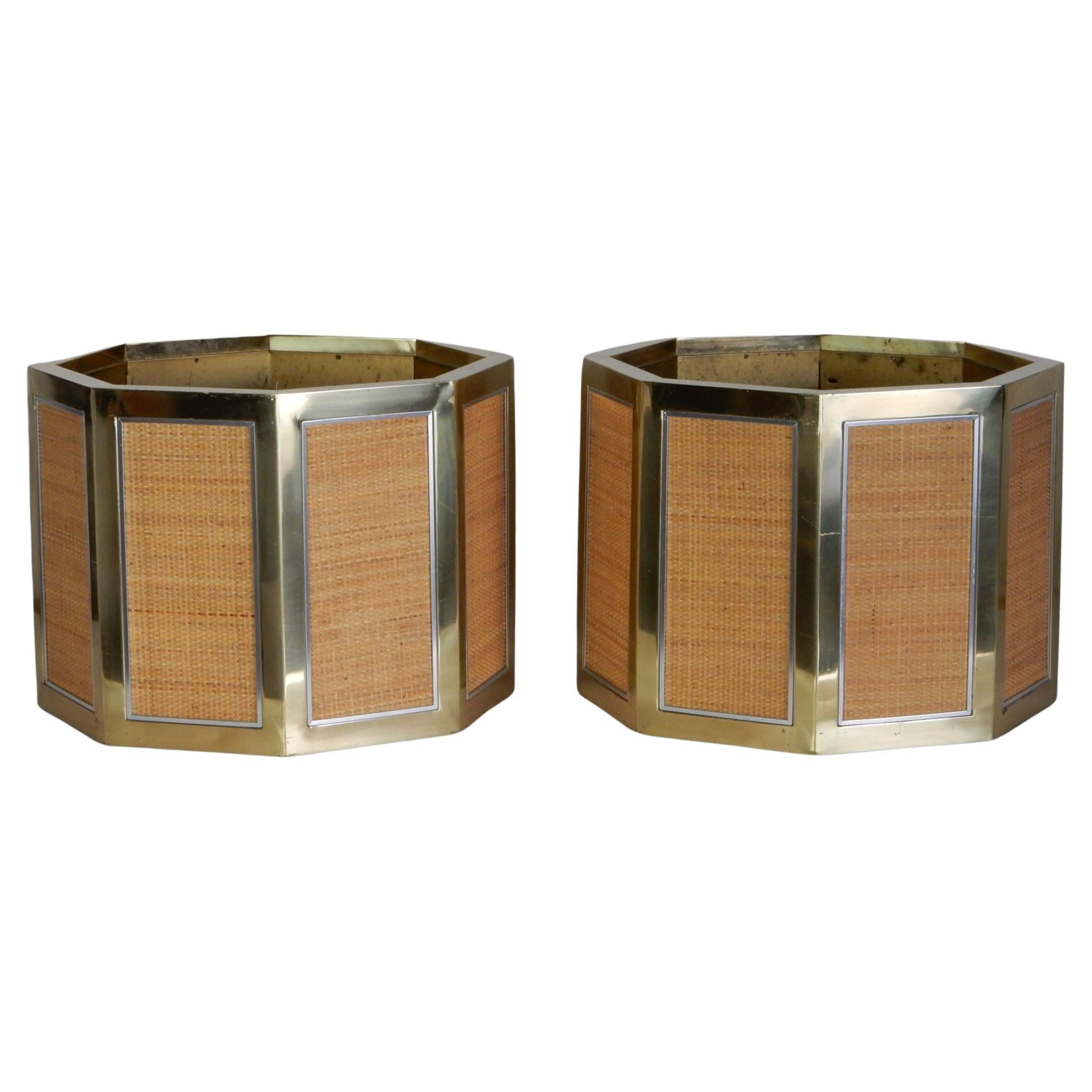 Rare massive scale octagon planter pots (pair) designed by Romeo Rega for Mario Sabot. Made in Italy, 1970's.
Formed on brass with 8 woven cane panels each trimmed in a polished steel frame.  Steel lining with adjustable height base.
25