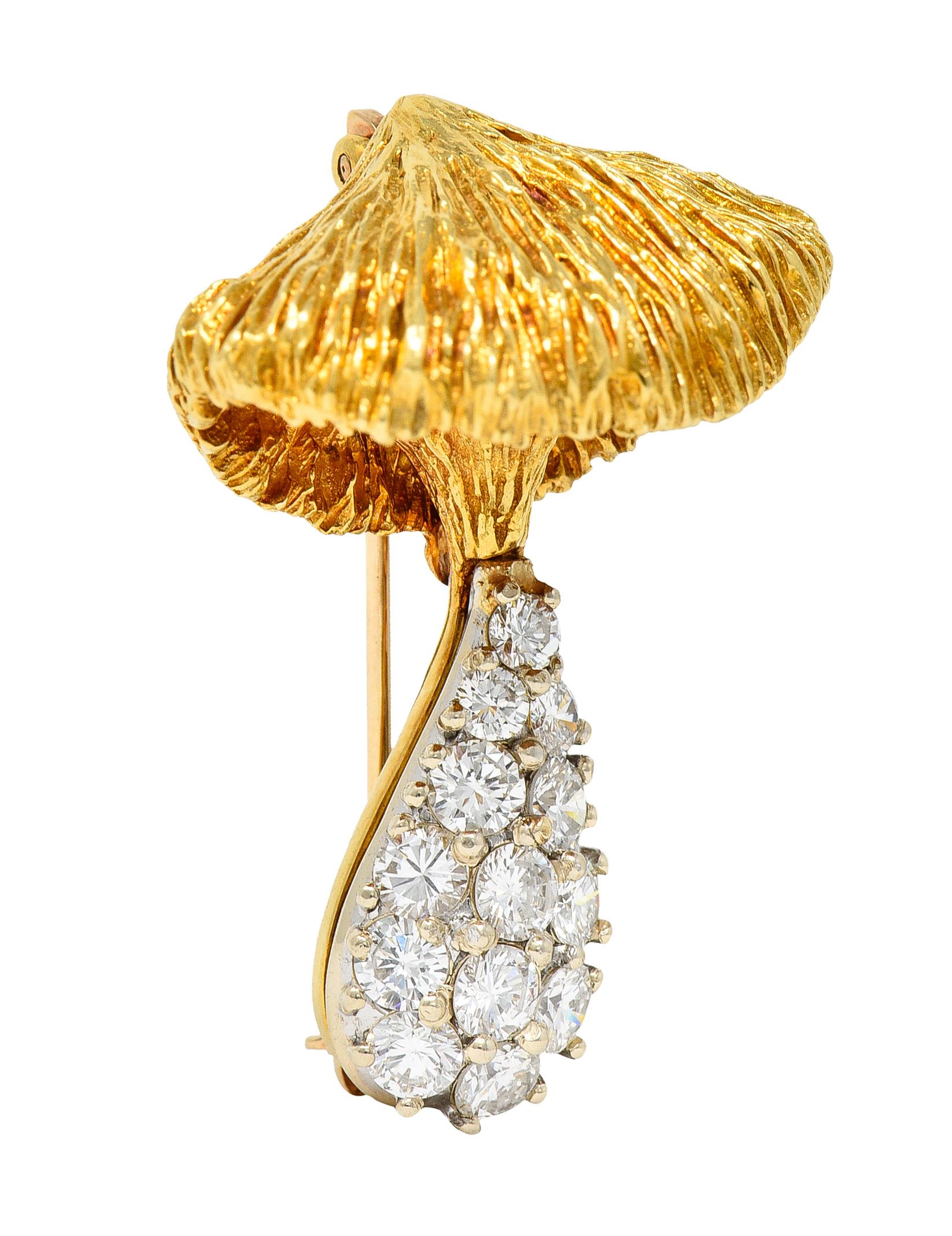 Designed as a stylized mushroom with a yellow gold top and white gold stem base

Top is dimensional and highly texturous while base is pavè set with round brilliant cut diamonds

Weighing in total approximately 1.25 carat with F to H color and VS