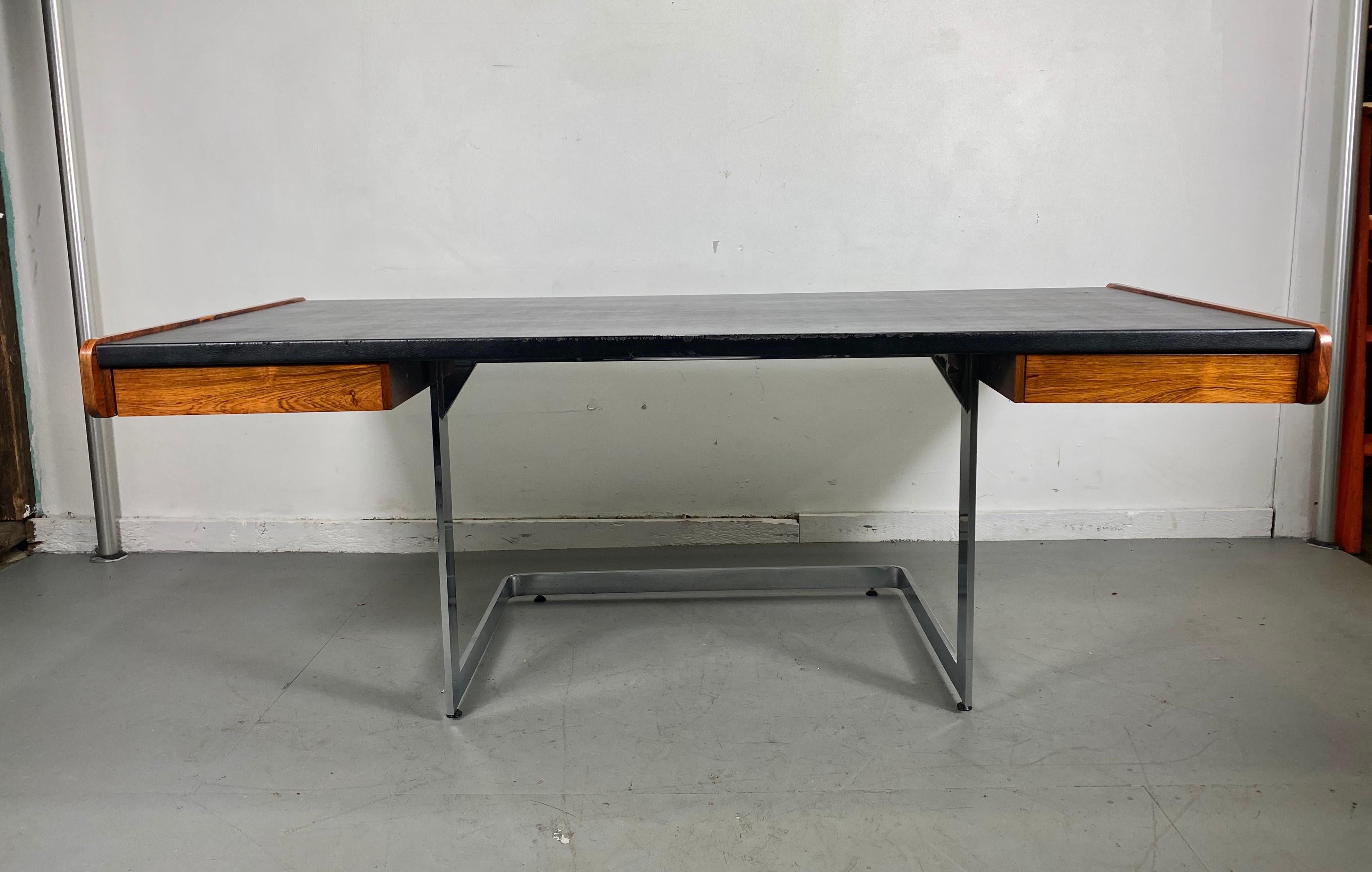 Stunning 1970s modernist desk on floating chrome base by Ste. Marie Laurent, leather top. Rosewood sides and drawers, retains original label in drawer, minor leather edge wear, (see photo), amazing design, Classic pop modern.