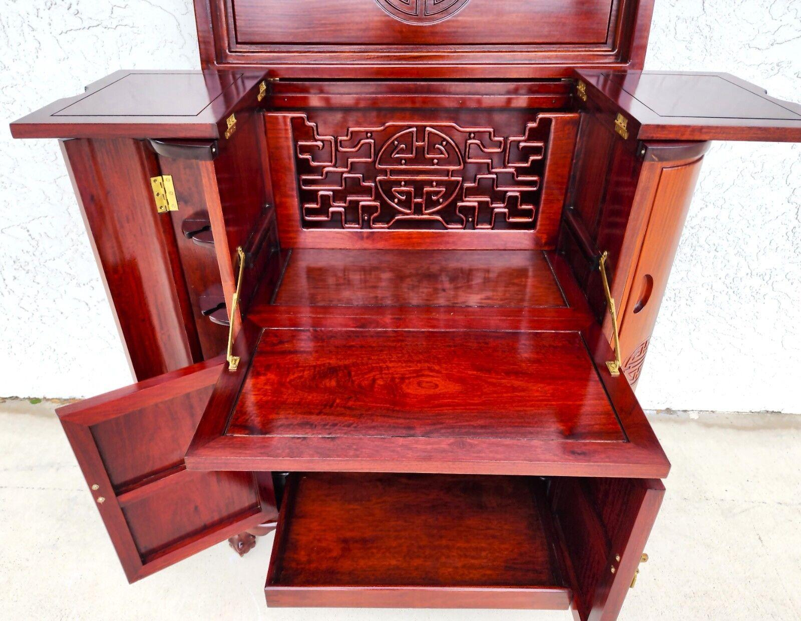 For FULL item description click on CONTINUE READING at the bottom of this page.

Offering One Of Our Recent Palm Beach Estate Fine Furniture Acquisitions Of A 
1970s Asian Oriental Hand-Carved Rosewood Dry Bar Cabinet Flip Top 
Wonderfully detailed