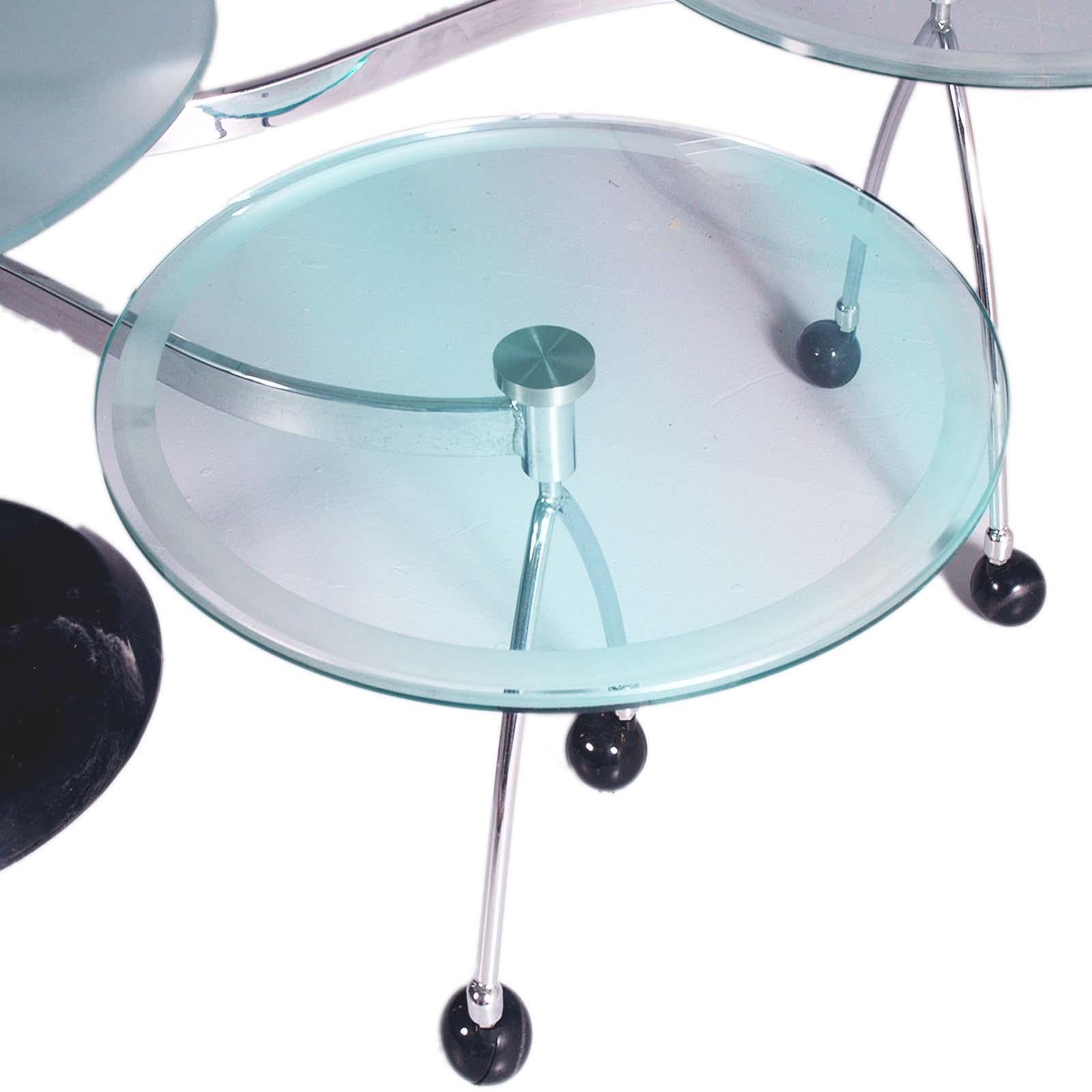 Modern 1970s triple round coffee table with two rotating satellites in sandblasted crystal, chromed metal structure with black marble base. Spherical swivel wheels. Very accurate and robust execution of the object. The two satellite tables rotate