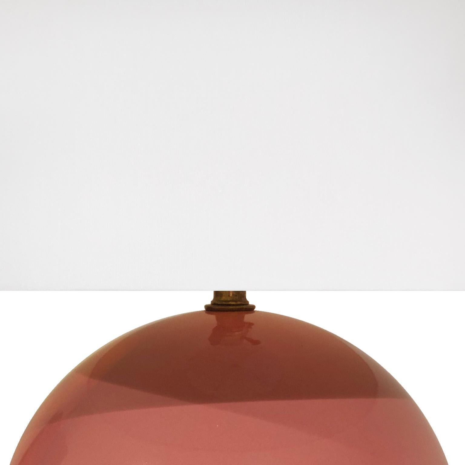 Round pink glaze ceramic table lamp. USA, 1970s.

Pair available, priced individually.