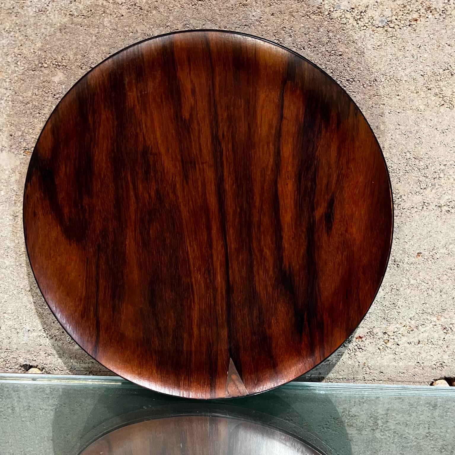 1970s round rosewood service tray Mid-Century Modern Japan.
Vintage service plate in laminated wood rosewood veneer top. Back panel is painted black.
No label present.
Measures:1 tall x 15 diameter
Attributed to Japan Production circa 1970s.