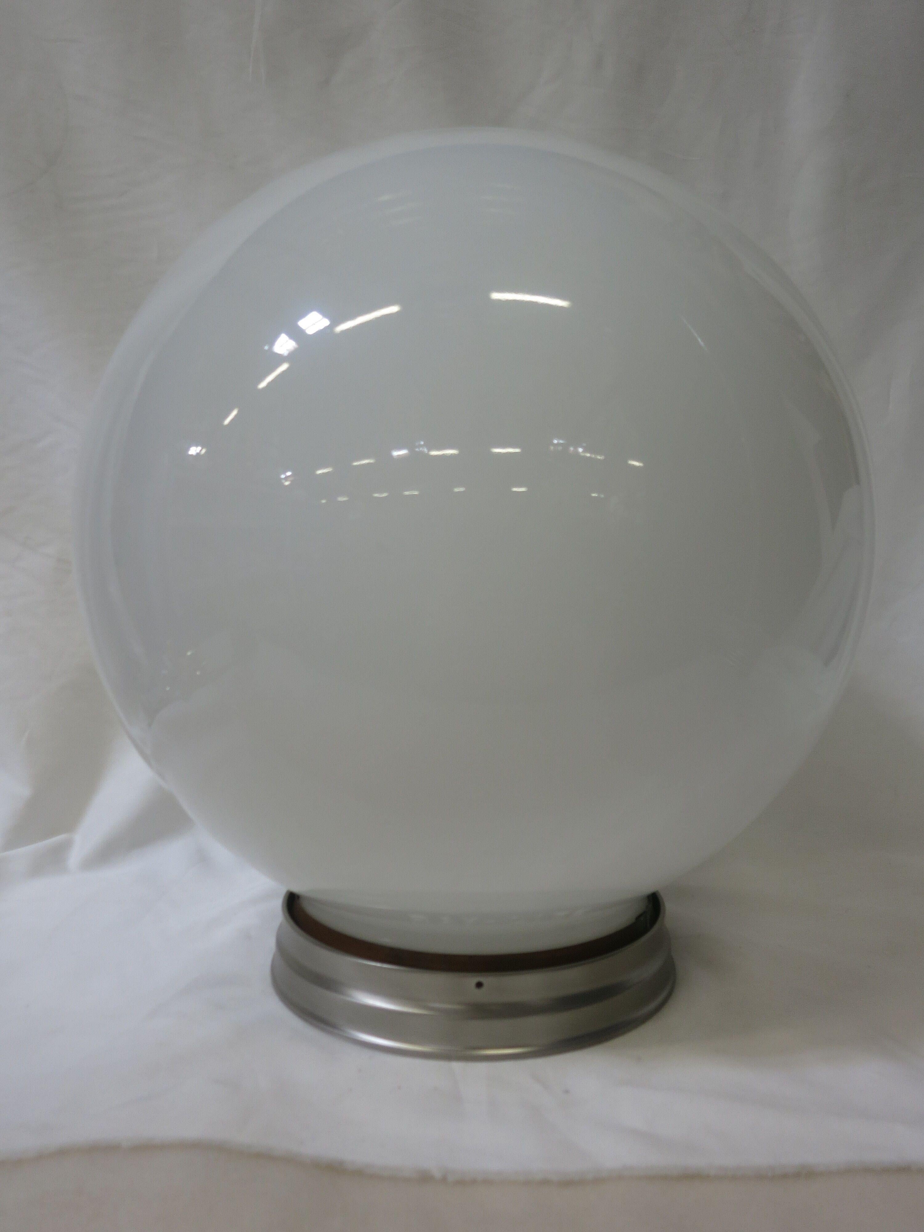 Large circa 1970 sphere shaped ceiling mounted globe with new UL compliment chrome fitter.

Globe, circa 1930.