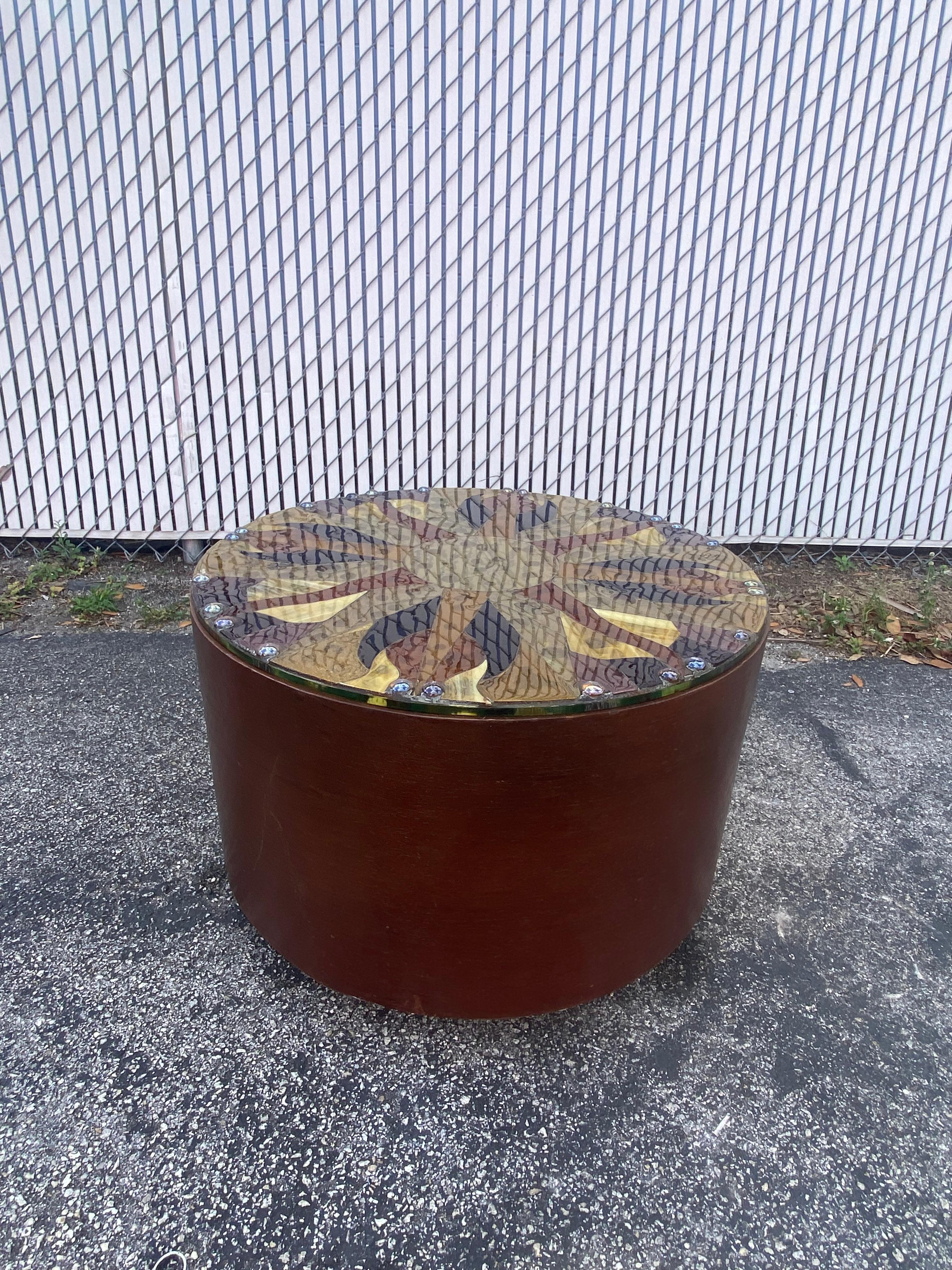 This rare vintage Milo Baughman circular wood table is packed with personality! Outstanding design is exhibited throughout. Has the signature brass laminated plinth base. Customized Murano Art Glass top. Perfect size for an end or coffee table. Bold