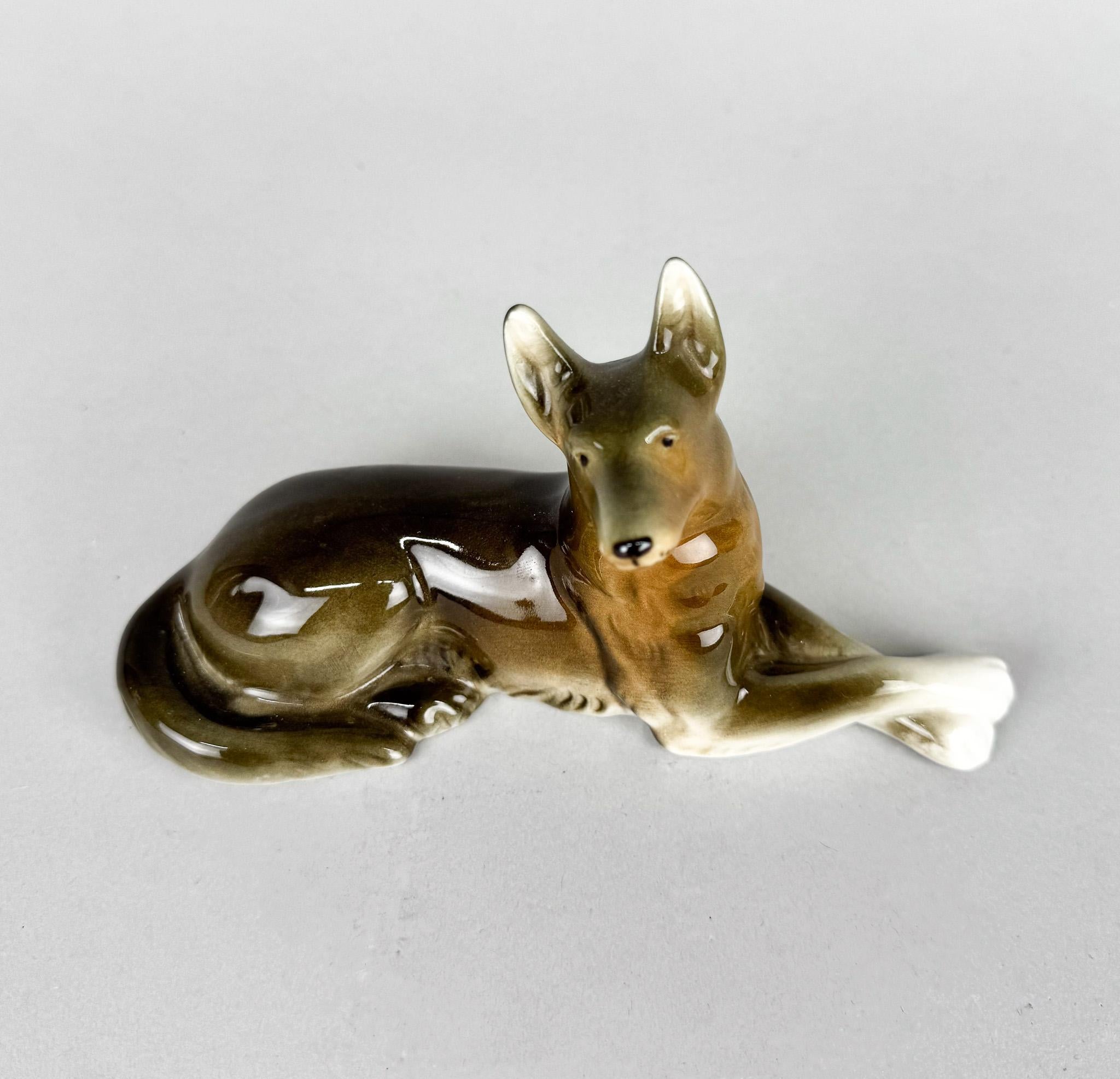 Porcelain statue of a German Shepherd, produced by Royal Dux in the 1970's in former Czechoslovakia.