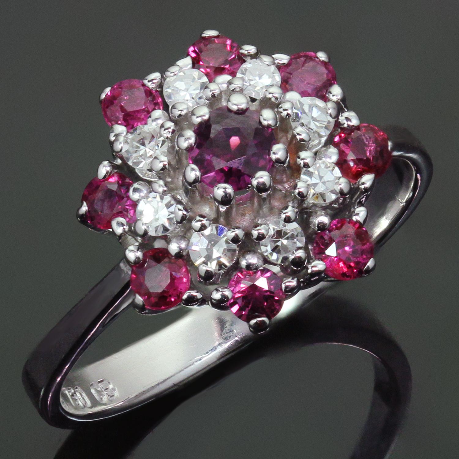 This fabulous vintage retro ring is crafted in 18k white gold and set with sparkling deep red round rubies and round brilliant G-H VS2-SI1 diamonds weighing an estimated 0.30 carats. Made in United States circa 1970s. Measurements: 0.47