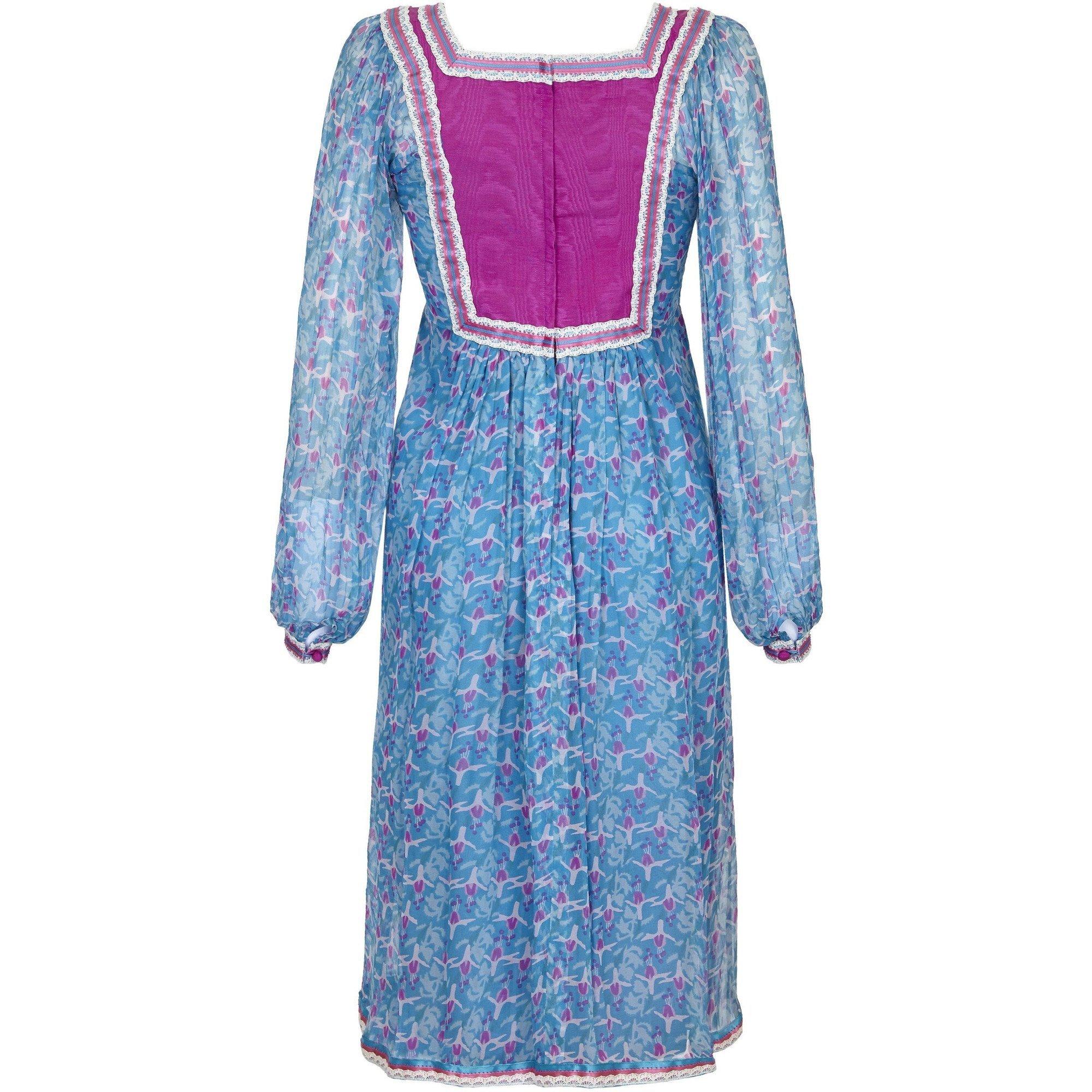 This charming late 1960s vintage or early 1970s blue and pink floral printed silk chiffon dress is from London design house Rumak, who created clothes to emulate the style and certainly the quality of  celebrated designer Thea Porter. This lovely