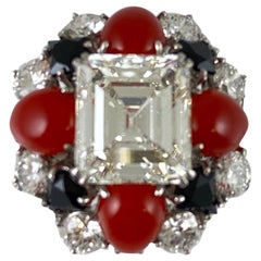 1970s Ruser with Center GIA Emerald Cut Coral and Onyx