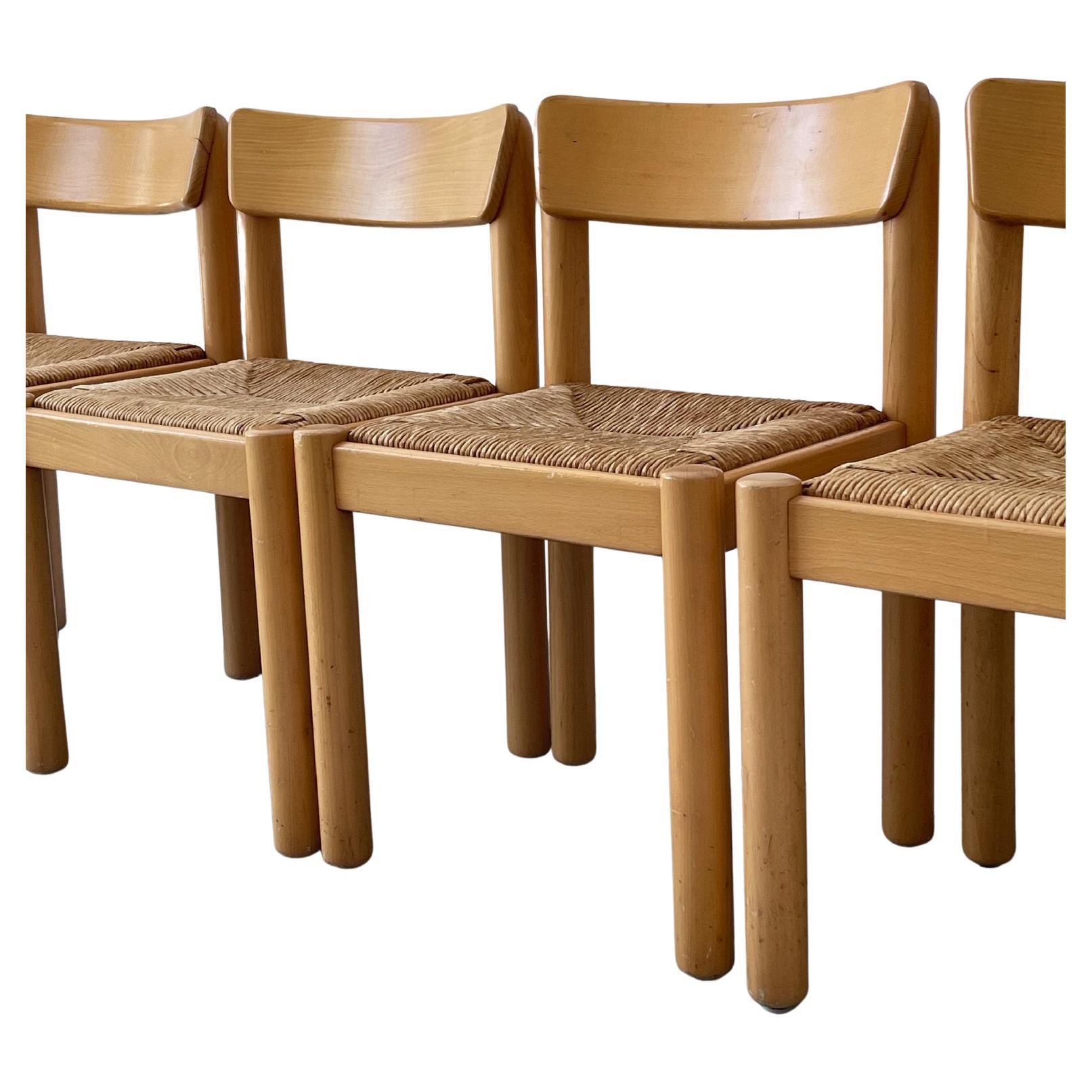 1970's Rush Chairs by Hank Lowenstein made in Italy. ?Natural maple wood frame with a strong woven rush seat. Chunky cylinder legs with a curved wood backing. All chairs stamped underneath seats. Vintage condition consistent with age and use. Sold
