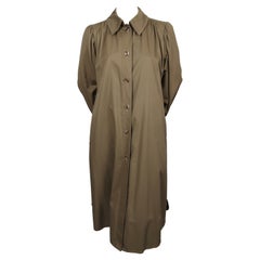 1970's SAINT LAURENT trench coat with puff sleeves and plaid wool lining