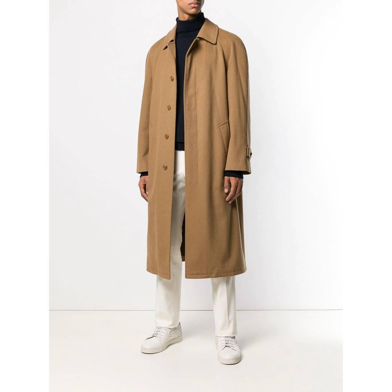 Salko loden beige wool coat. English front closure with buttons, two pockets and an internal pocket with zip, classic collar, cannon pleat on the back. Removable inner lining in red and white checked wool fabric.

This item belongs to an original