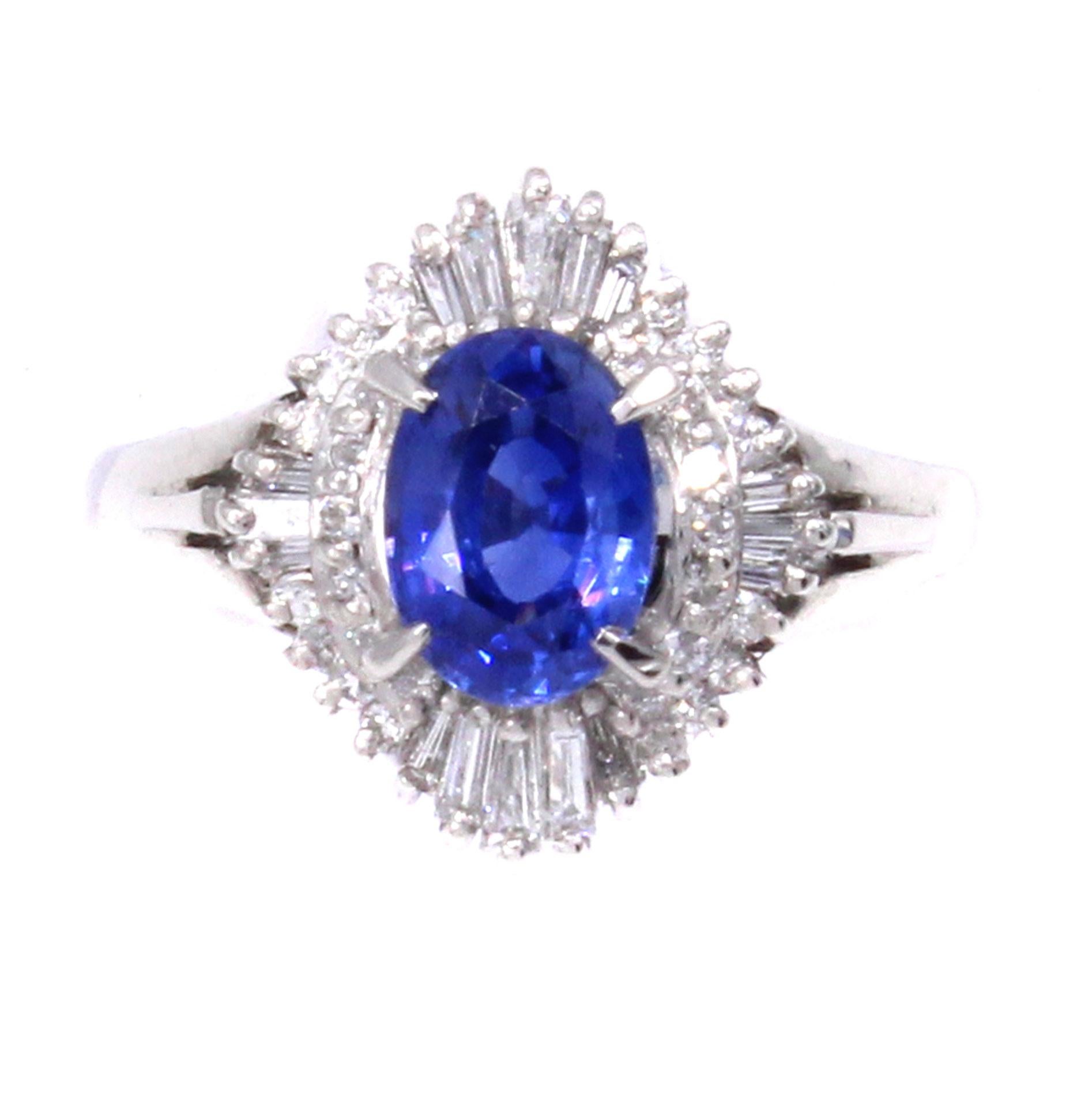 A beautiful deep sky blue well saturated oval sapphire weighing 1.51 carats is the center piece of this lovely 1970s ring. Masterfully hand-crafted in platinum, the center gem is embellished by perfectly matched bright white and sparkly round and
